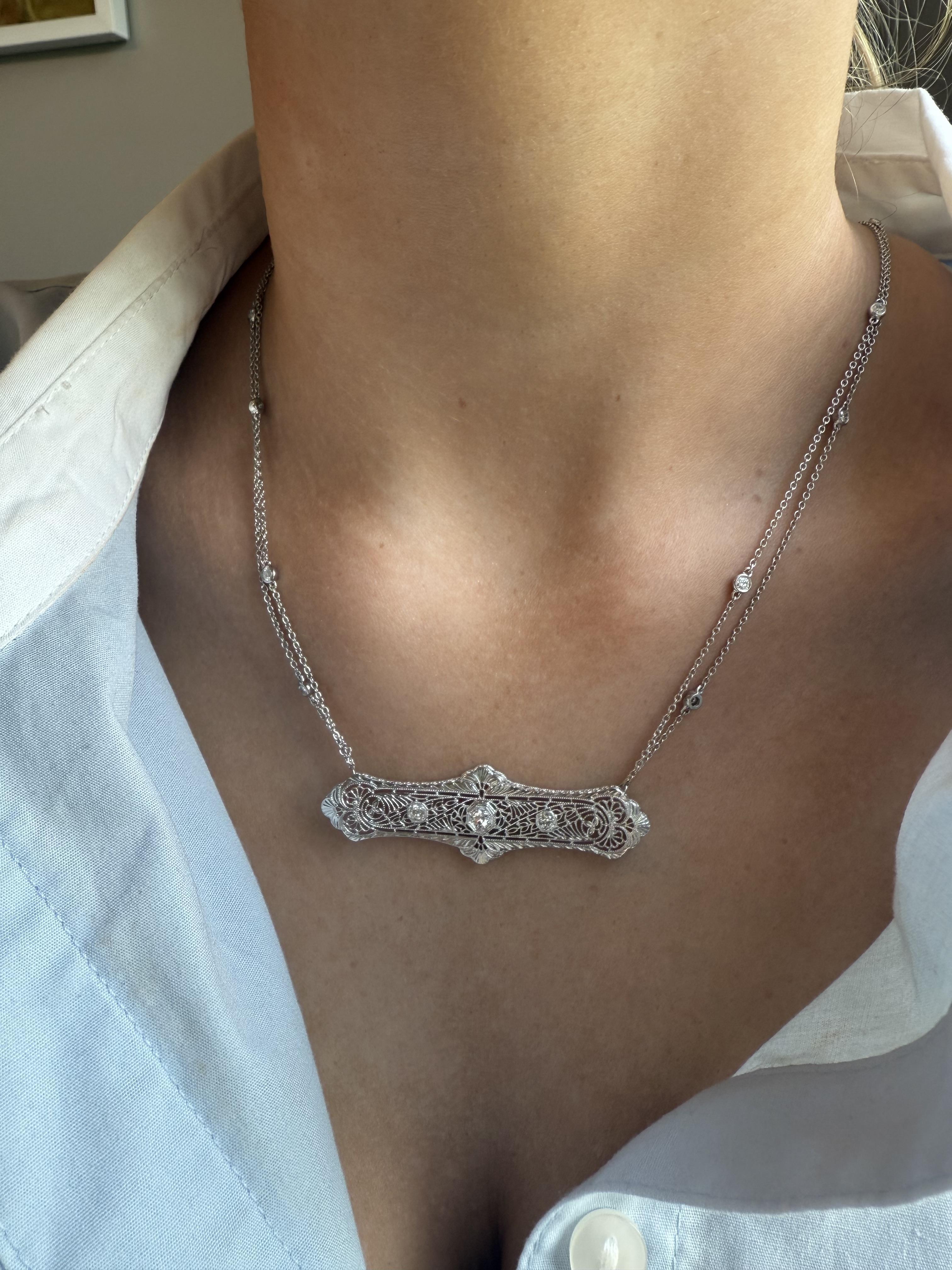 We are loving the combination of this vintage brooch and diamond accented double chain!!!

Necklace Details
Material: 14K White Gold Pendant; 18K White Gold Chain
Era: Art Deco 1920 - 1940; Modern Chain
Weight: 9.1 Grams
Chain Length: 18