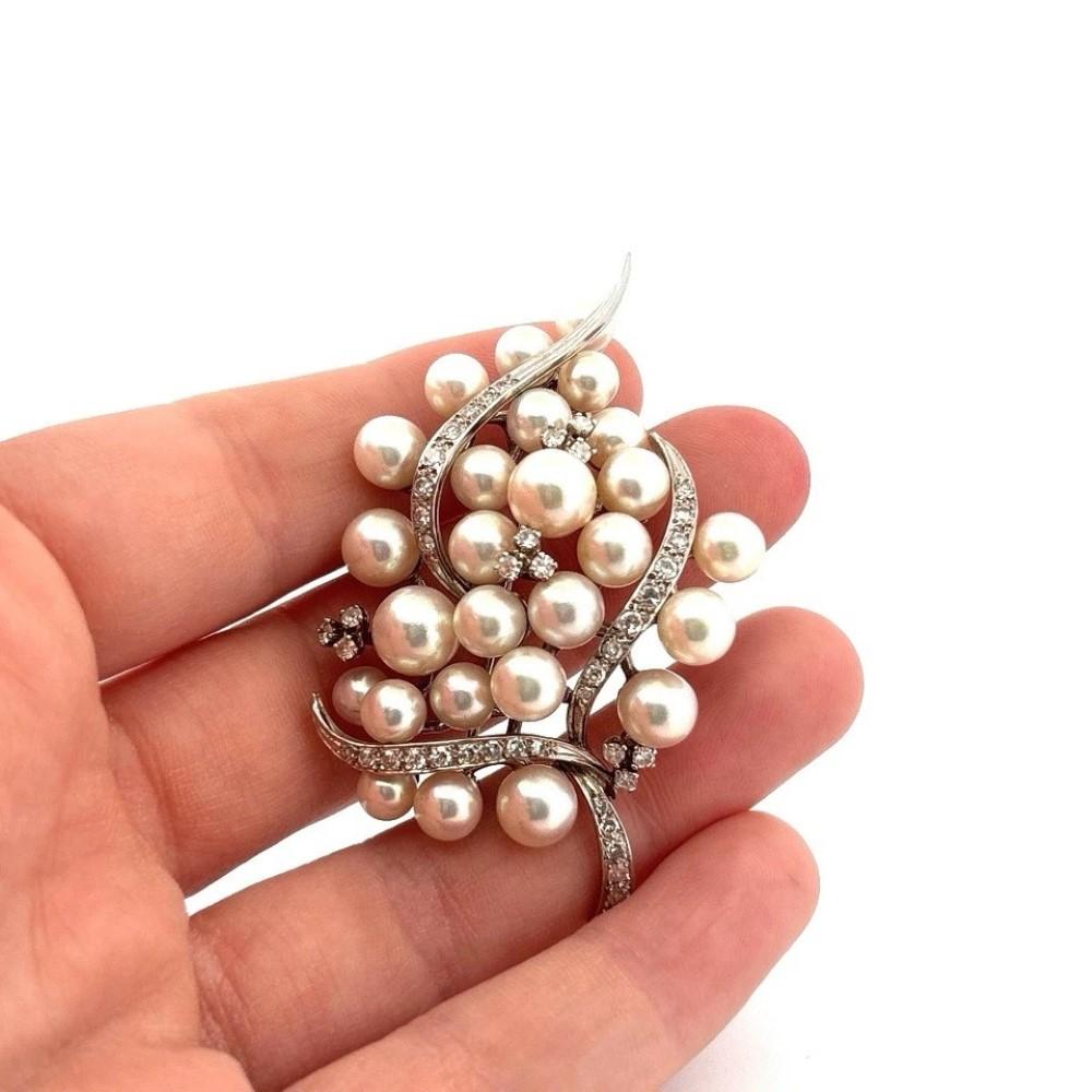 Fine 14K White Gold Akoya Pearl & Diamond Brooch – 6cm Vintage Pin

Description:
🡆 This exceptional Akoya pearl and diamond brooch is crafted in 14K white gold (tested, not stamped) and designed with an elegant swirling motif. It features cultured