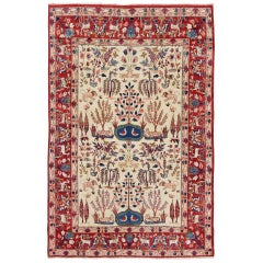 Tapis persan d'Ispahan vintage à motifs de la nature en ivoire, bleu, marron et rouge