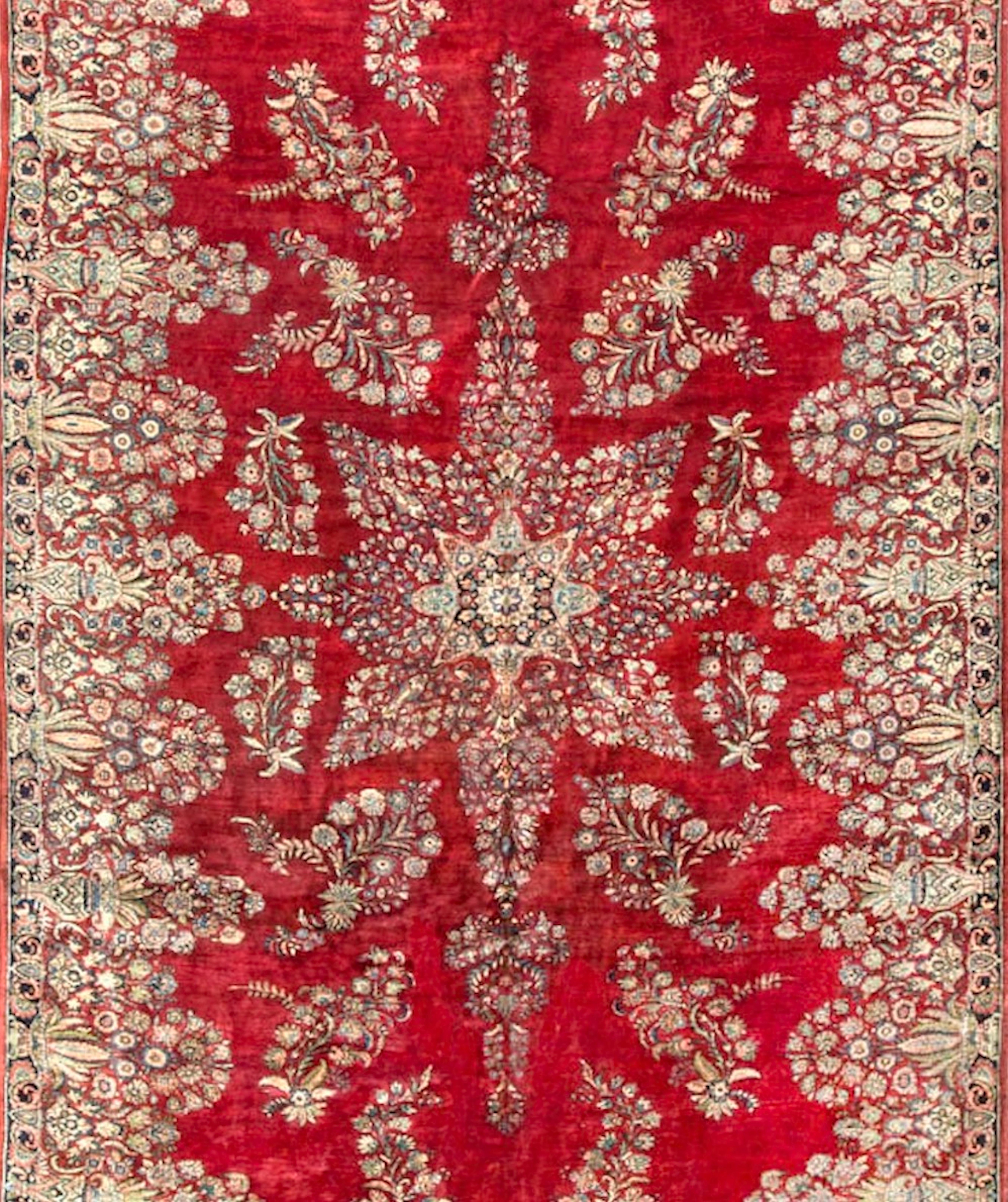 The dramatic style and colors of this rug will generate a unique ambiance in any room setting. The central star shaped medallion with the pattern repeated in the surrounding borders creates an overall harmony to the piece. Measures: 10'9
