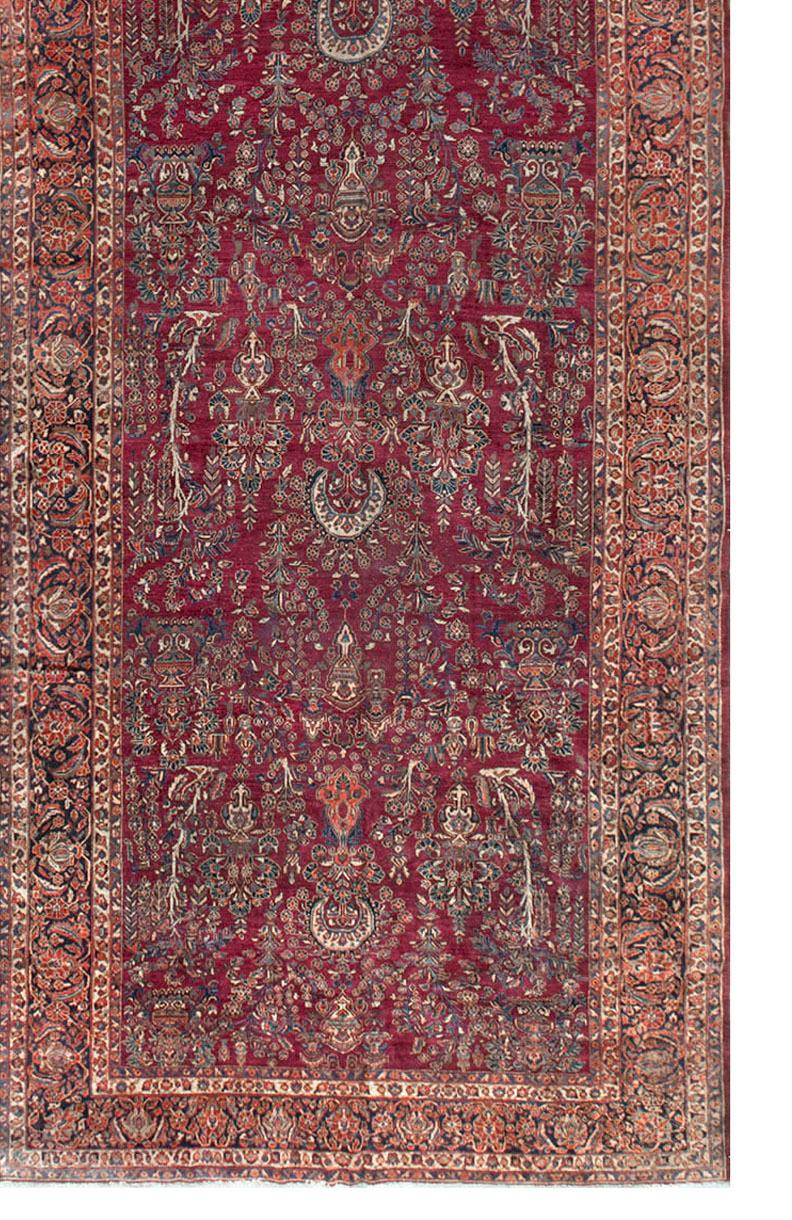 It is getting more and more difficult to find a vintage gallery rug of these dimensions. The main field with its profusion of floral designs is so nicely complimented by the main border enclosed by guard borders. Sarouk rugs are from the village of