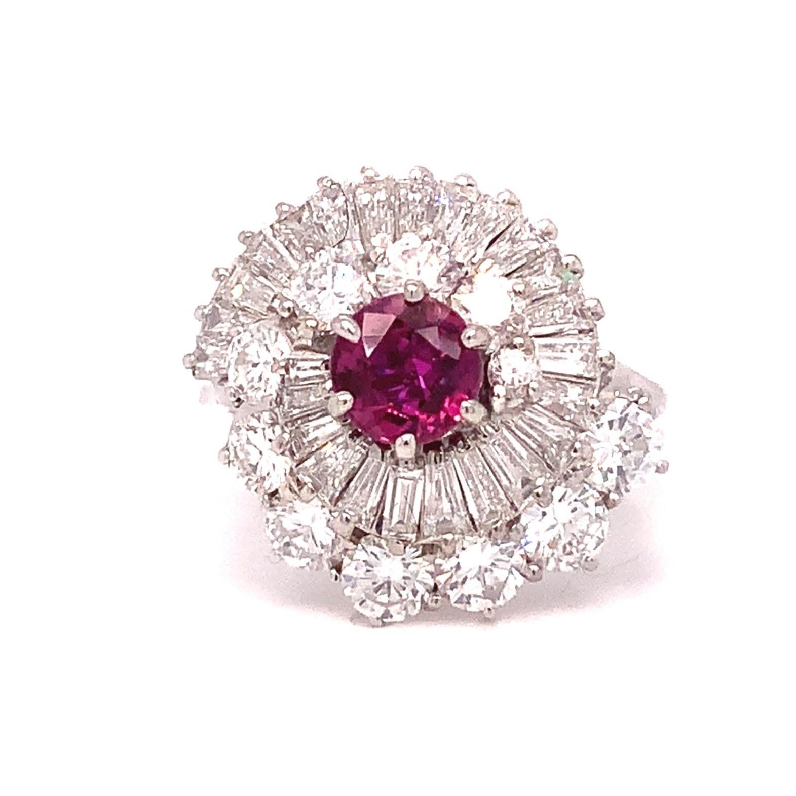 This exquisite Vintage Fine Quality Ruby and Diamond Ballerina Ring Set is crafted in 18 kt white gold and features a striking contrast between the rubies and diamonds for a remarkable look. The classic design of the ring is sure to stand the test
