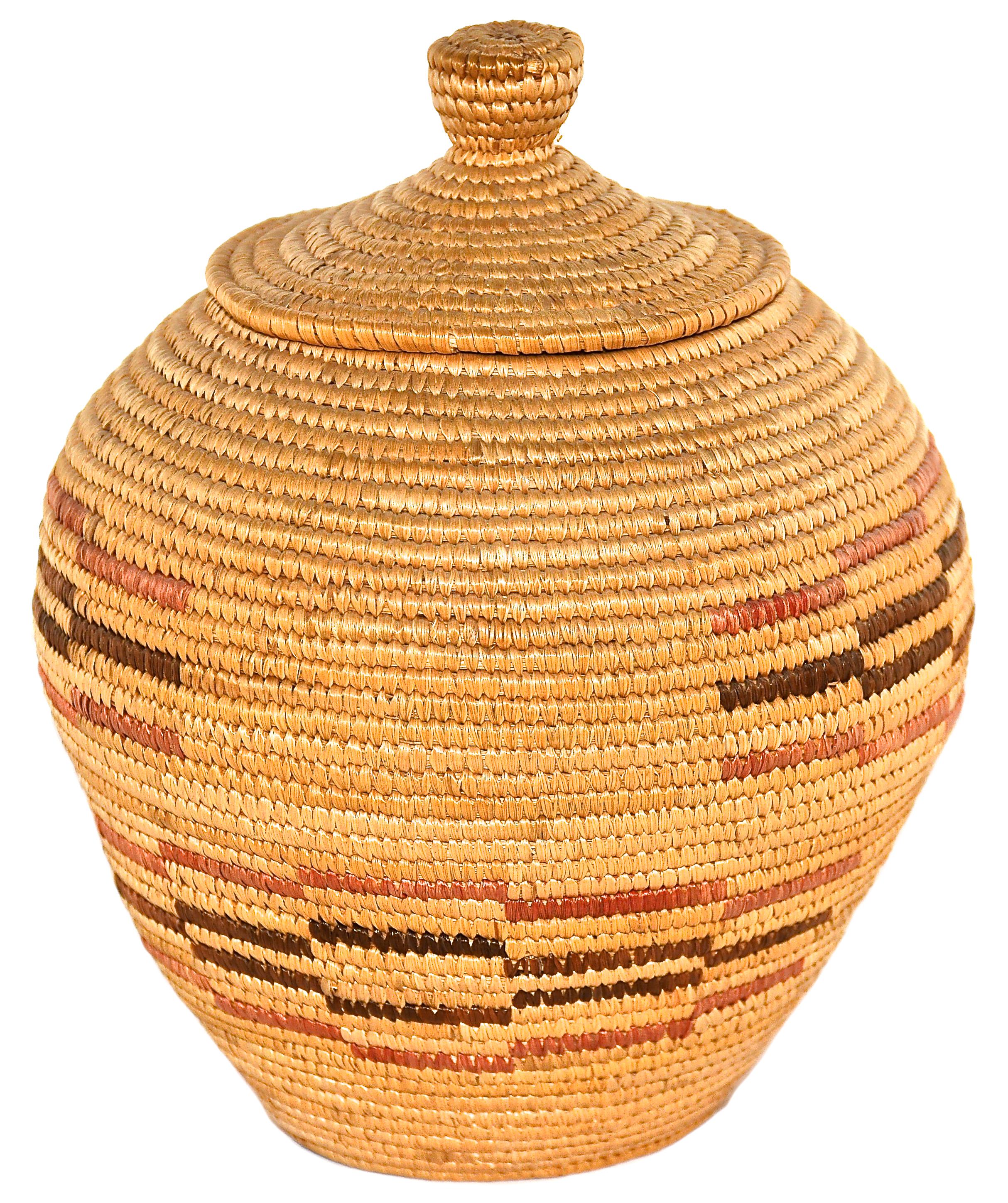 Finely Coiled Lidded grass basket
Eskimo
Hopper Bay, Alaska
Beach grass and dyed beach grass
1960s
7 inches Height x 4 inches in Diameter

This is a vintage Eskimo basket from Hopper Bay, Alaska made in the 1960s.

Far to the west along the