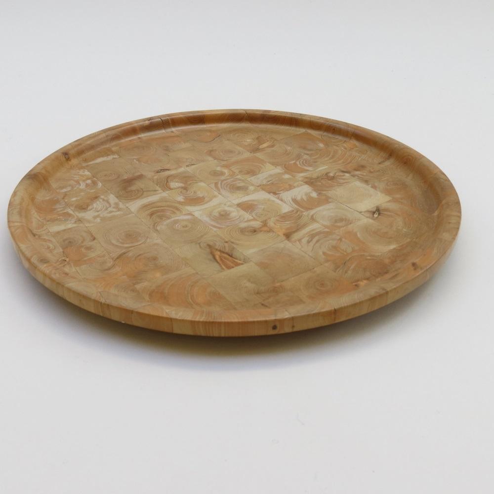 Vintage wooden tray plate made from block wood and then hand-turned. Hand produced in Finland the early 1980s from solid Juniper wood

Yvaskuua Finland 1980 hand written to the underside
Wonderful grain and color
Measures: 26cm diameter x 2cm