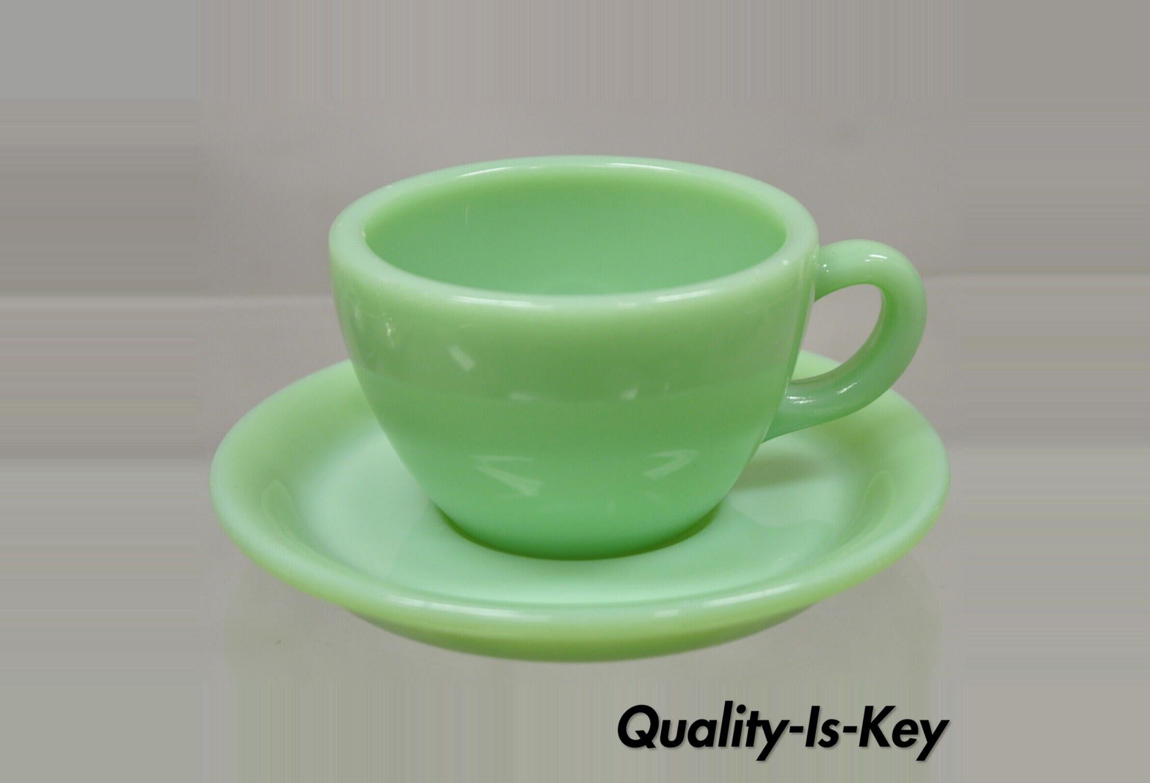 Vintage Fire King Jadeite Green Oven Ware Cup and Saucer with Damage. Circa Mid 20th Century.
Measurements: 
Cup: 2.5