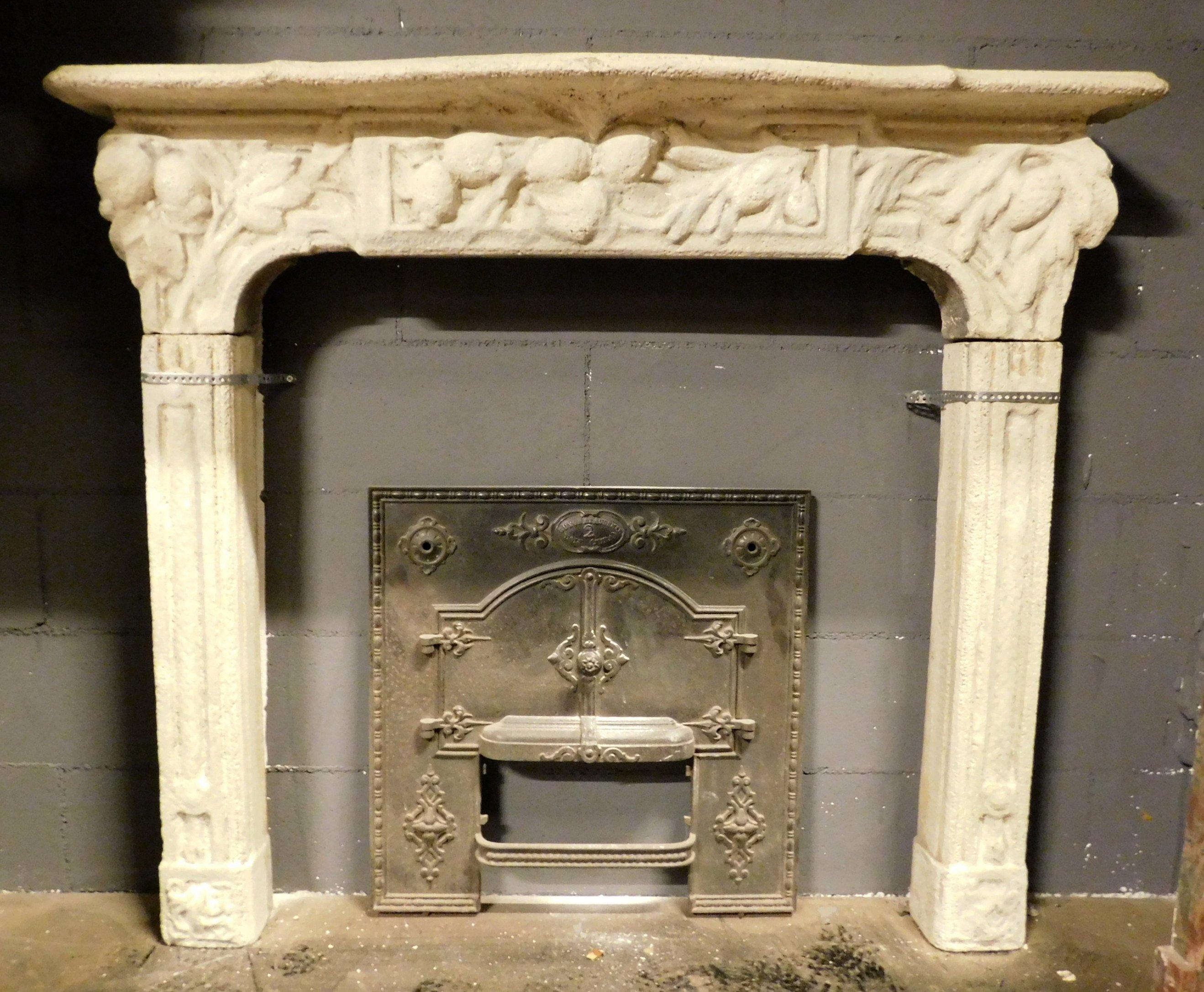 Antique fireplace mantel hand-carved in beige colored concrete, carved with floral shapes and cornucopias, produced by an artisan at the beginning of the 20th century in Italy.
Charming and discreet, ideal for enriching the warmth of your interior,