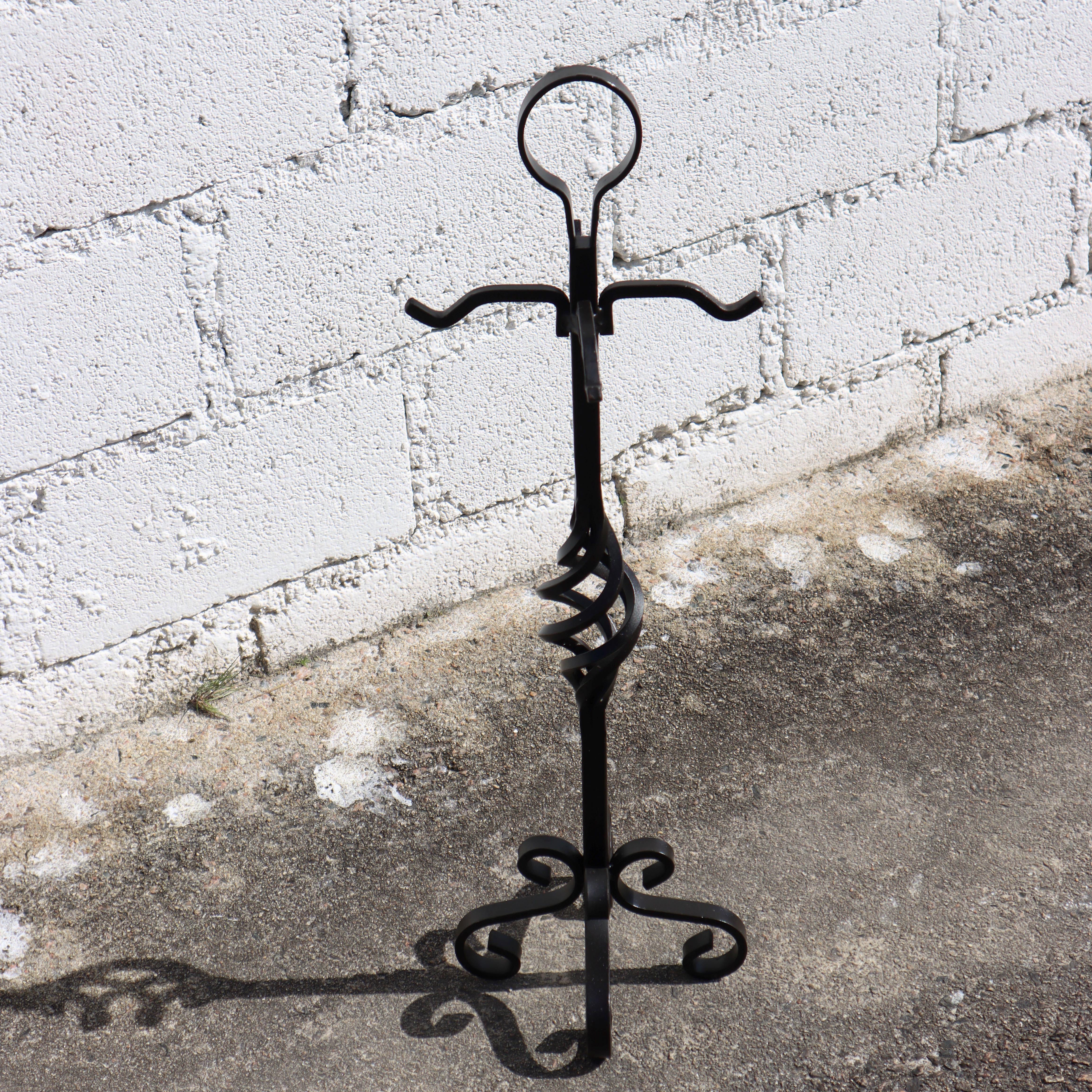 This French wrought iron fireplace set, designed in a Gothic style from the 1970s, boasts a heavy and solid construction. 
The vintage set includes a stand, shovel, broom, tongs, and a carved bellow that functions well. 
It's a high-quality ensemble