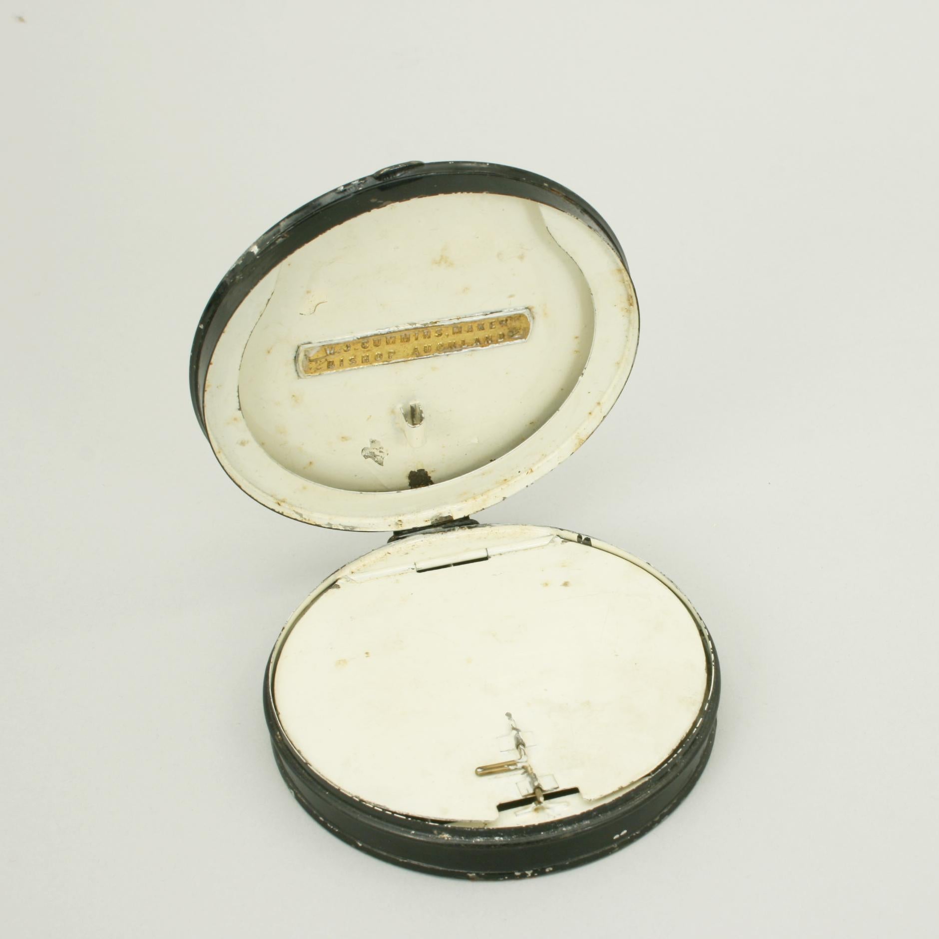 Round metal fishing cast tin.
A circular black japanned fishing tin made by W.J. Cummins of Bishop Auckland. The fishing cast and fly box is in good original condition. The interior is cream in colour with the lid for casts and the base fitted with