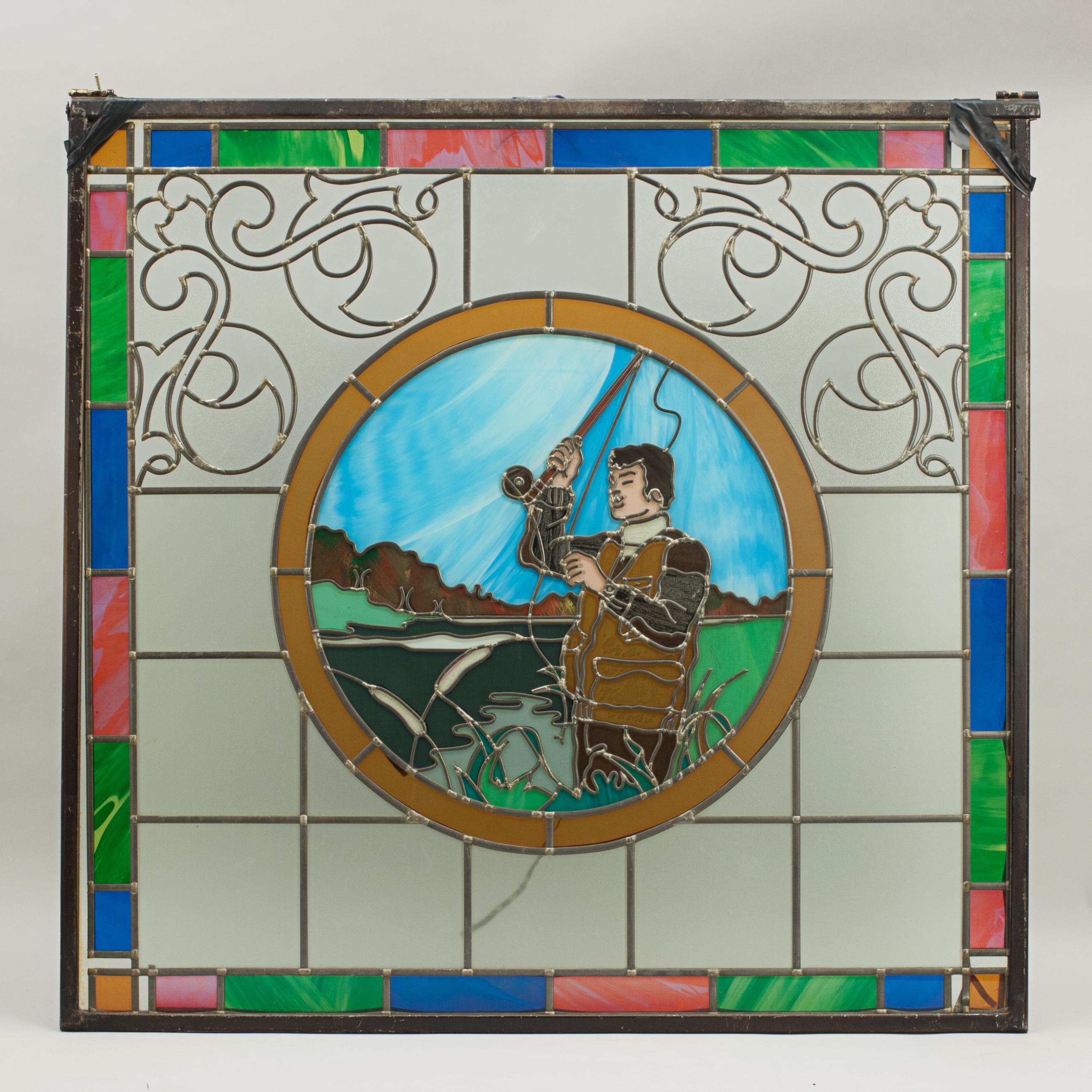 A magnificent sporting stained glass window depicting a fishing scene. The window shows an angler about to cast off, the edging of the window made of colored glass. The colored leaded window was made for the centenary of the 'Mansfield Bar' in
