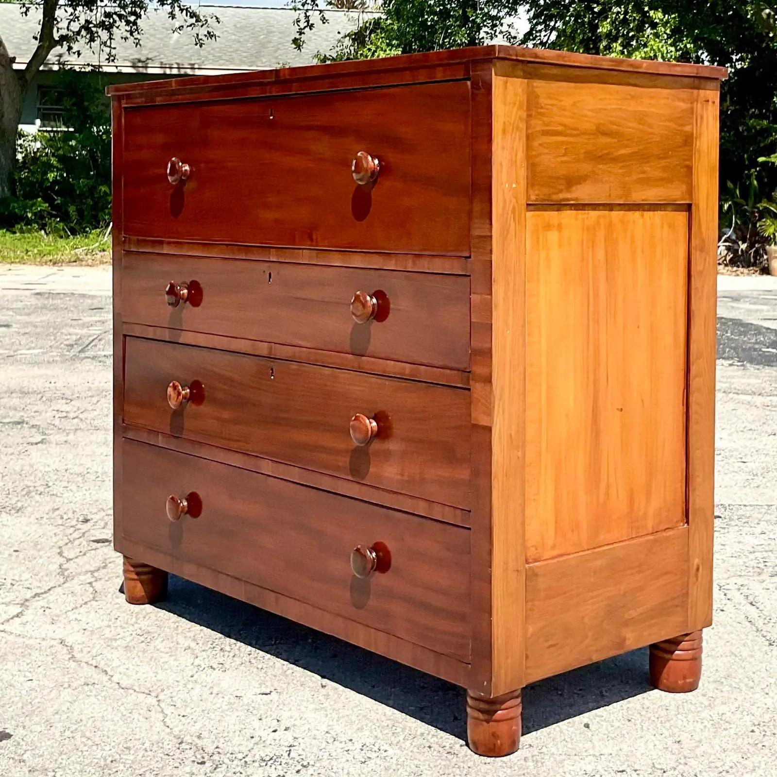 Fantastic vintage flame mahogany chest of drawers. Monumental and solid hard wood. A real showstopper. Perfect as a chest or a great piece in an entry with a mirror. Acquired from a Palm Beach estate.