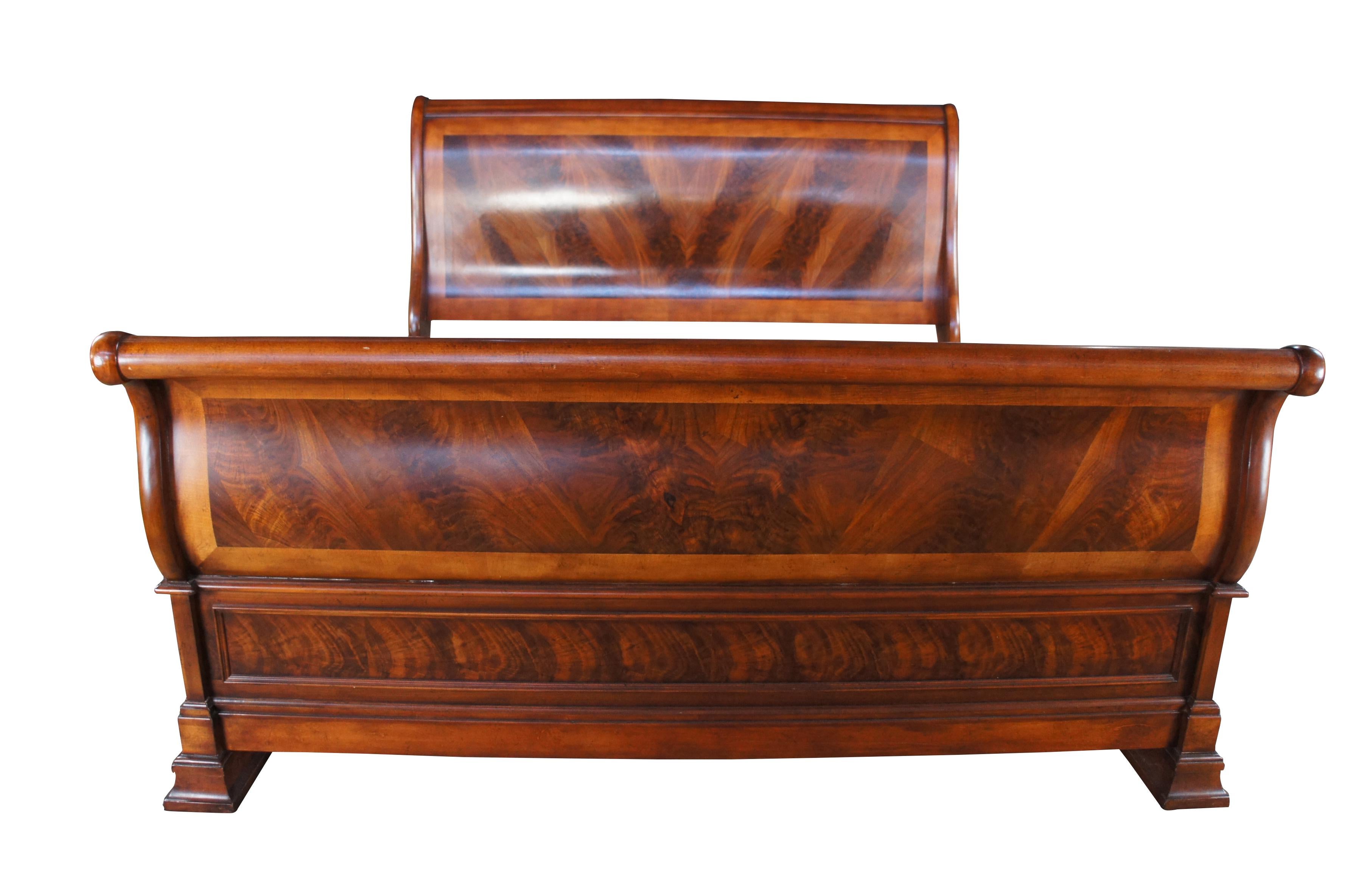 A large and impressive vintage king size sleigh bed.  Made of flame mahogany featuring traditional serpentine form.

Dimensions:
101.5