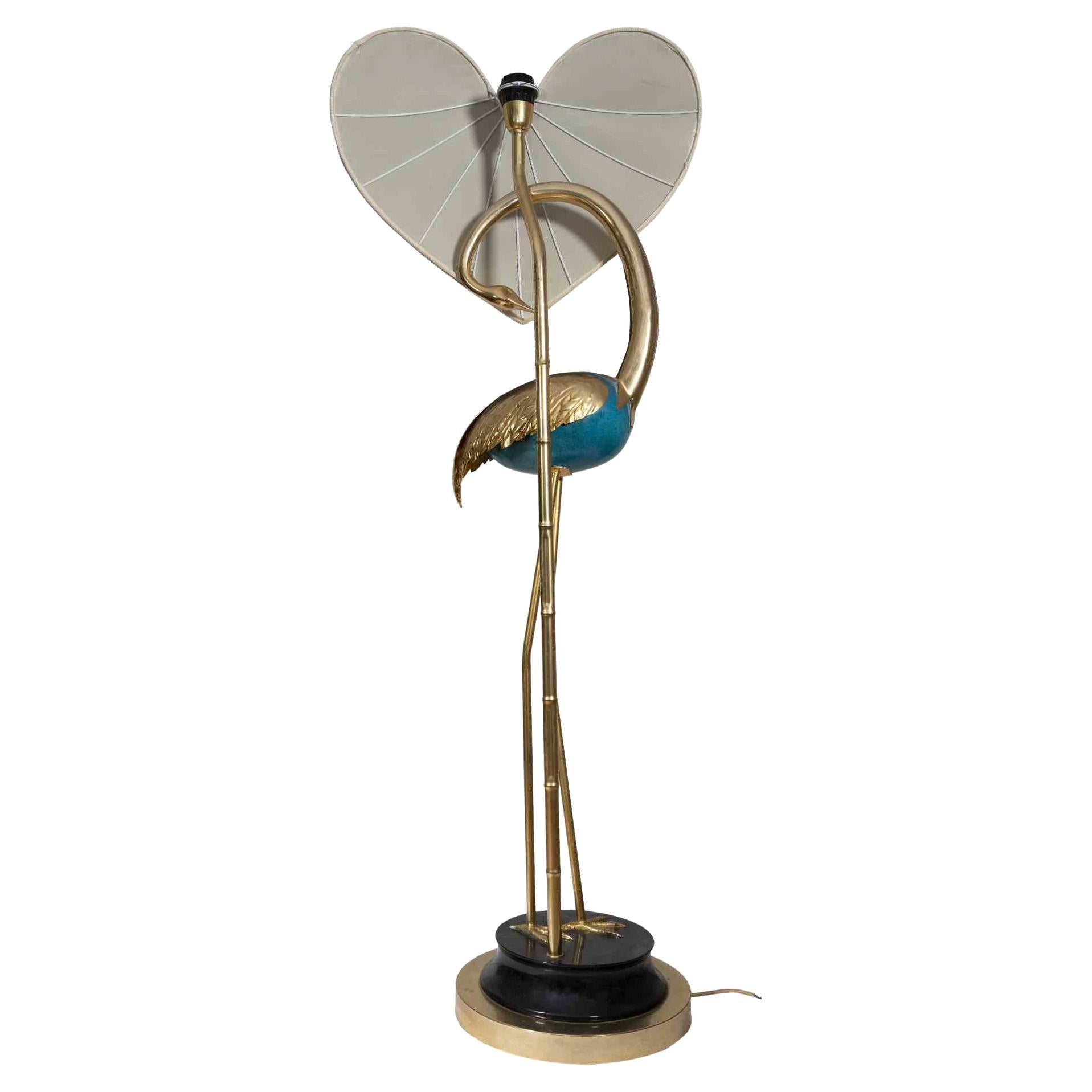 Vintage Flamingo Turquoise and Gold Lamp is a vintage design lamp realized by Antonio Pavia in Italy the 1970s.

Gold and turquise enameled brass Hollywood Regency Style. Lacquered wood and brass base. Requires regular up to 60 watt light bulbs. One