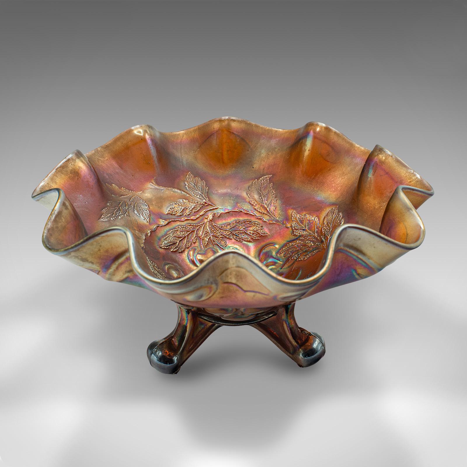 
This is a vintage flared Carnival dish. An English, lustre glass decorative bonbon bowl, dating to the Art Deco period, circa 1930.

Striking lustre dances throughout this extravagant bowl
Displays a desirable aged patina and in good order
Deep