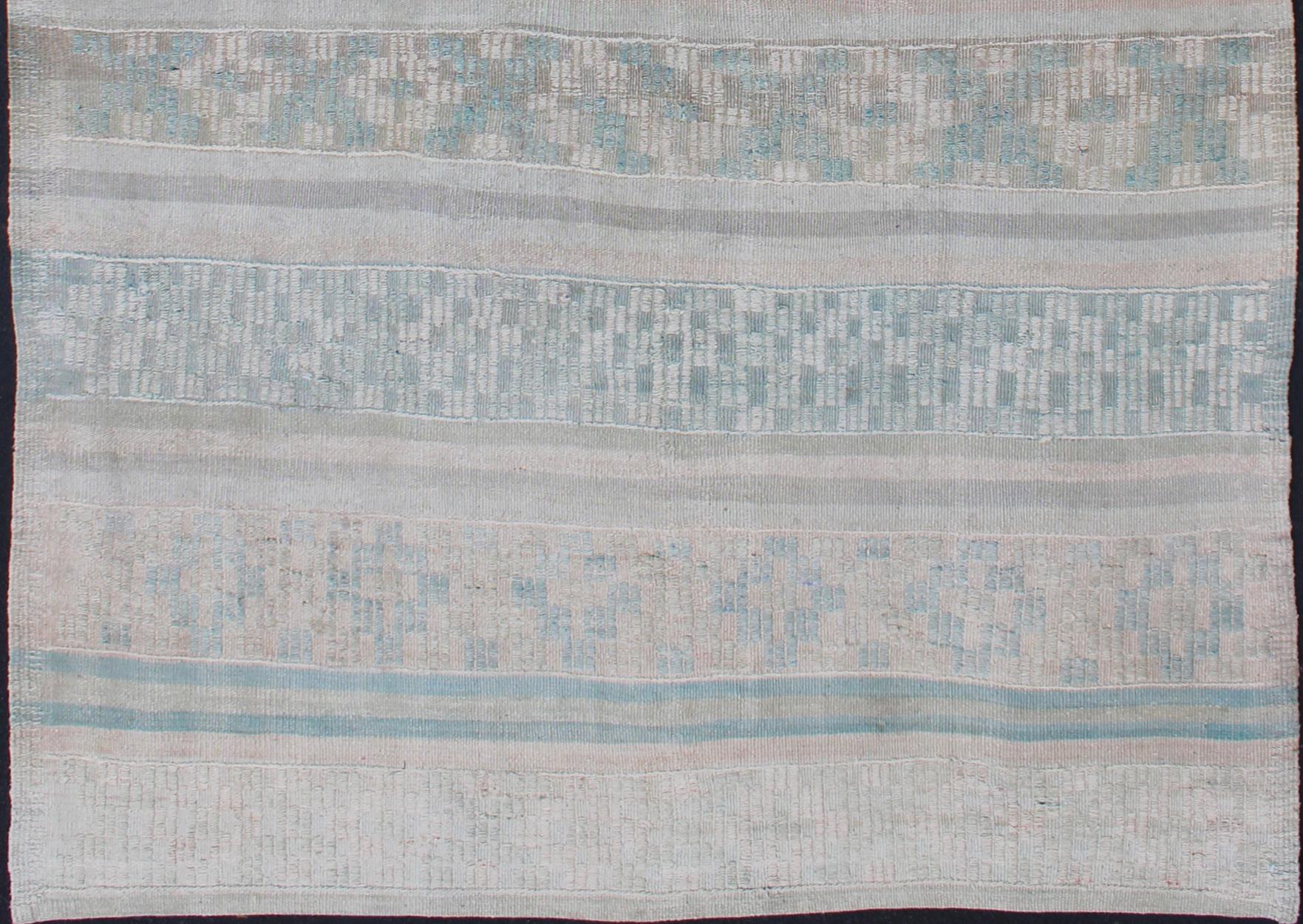Vintage flat-weave Kilim with embroideries in blush, green, blue and gray with a modern design
geometric stripe design Vintage Kilim from Turkey, rug en-176470, country of origin / type: Turkey / Kilim, circa 1950

This vintage Turkish Kilim rug