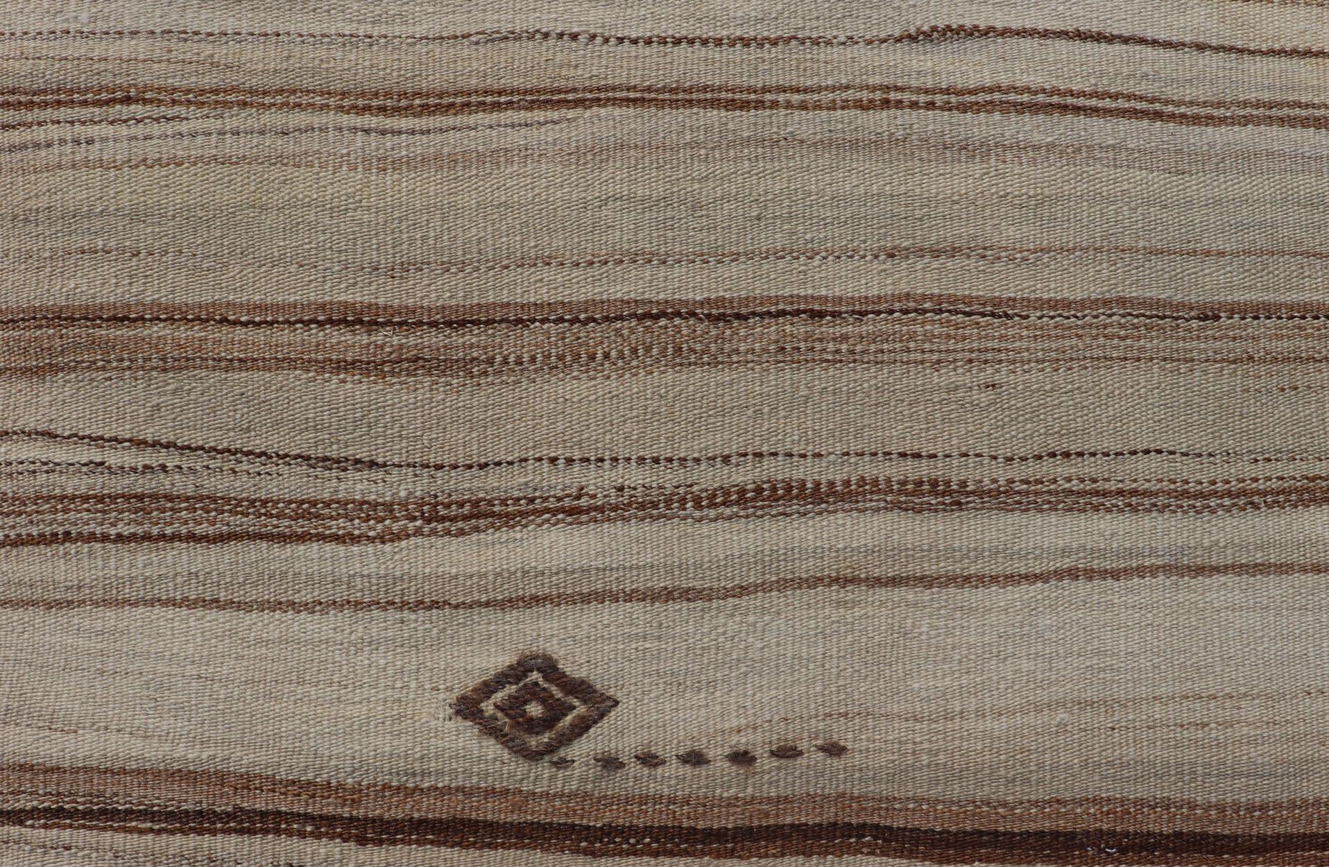 Vintage Flat Weave Turkish Kilim with Stripes in Tan, Taupe, Cream, and Brown.  Vintage Turkish Kilim, Keivan Woven Arts / rug EN-P13141, country of origin / type: Turkey / Kilim, circa Mid-20th Century.

This vintage flat-woven Kilim features a