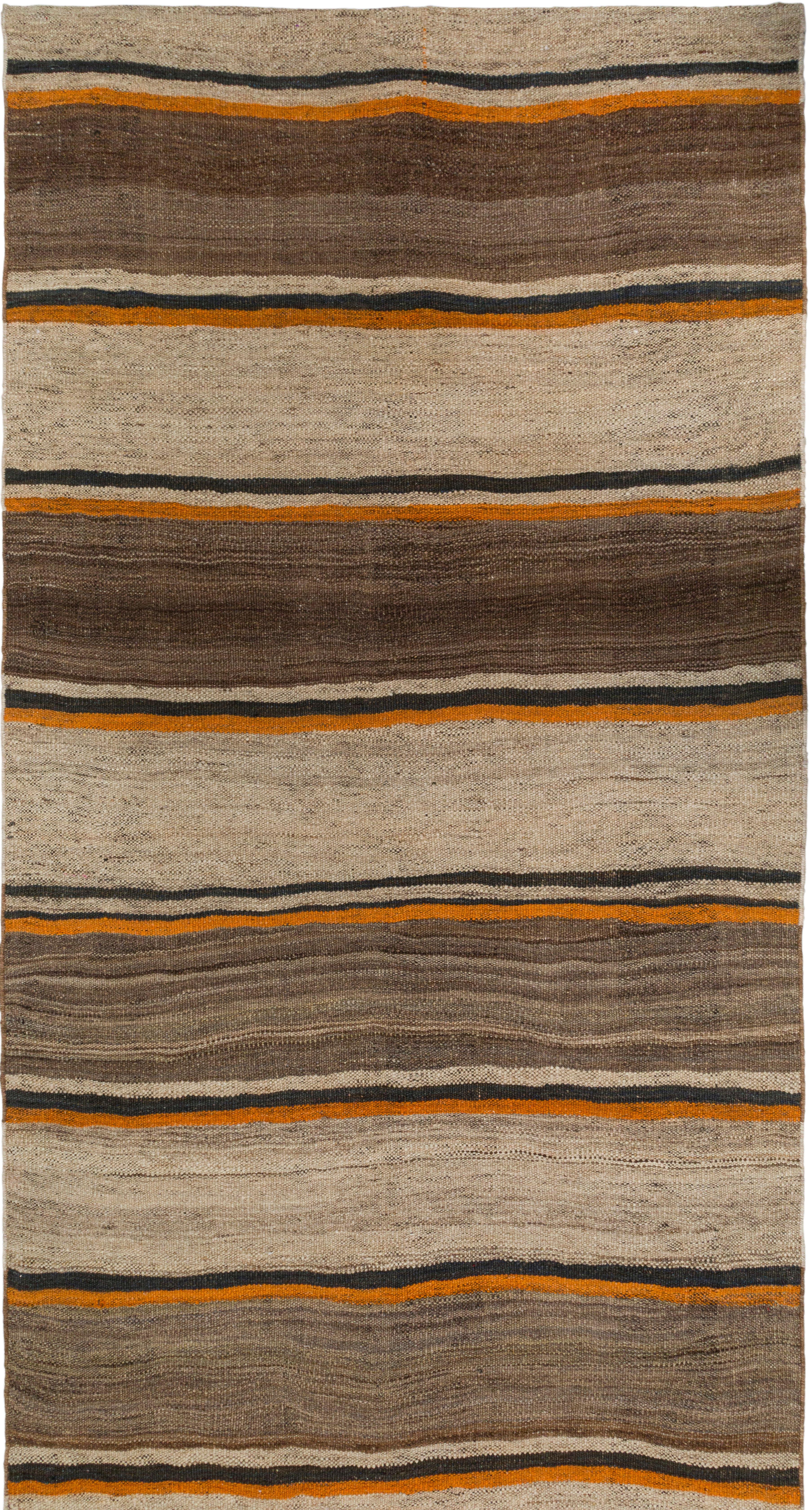 Vintage Flatweave Runner – Timeless Minimalist Craftsmanship

Discover the elegance of this 50-year-old vintage flatweave runner, showcasing a harmonious blend of light brown, beige, and orange stripes. A masterpiece of minimalist craftsmanship,