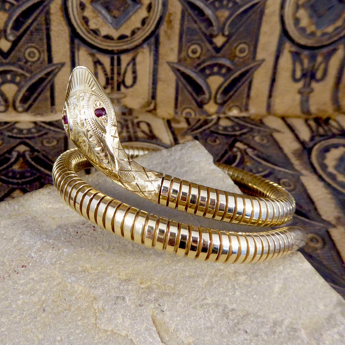 This vintage snake bracelet features two ruby stones for eyes and is very flexible for ease when taking on and off. The snake used in jewellery symbolises eternity and wisdom as the Queen pronounces the snake to be a figure of eternal love in the