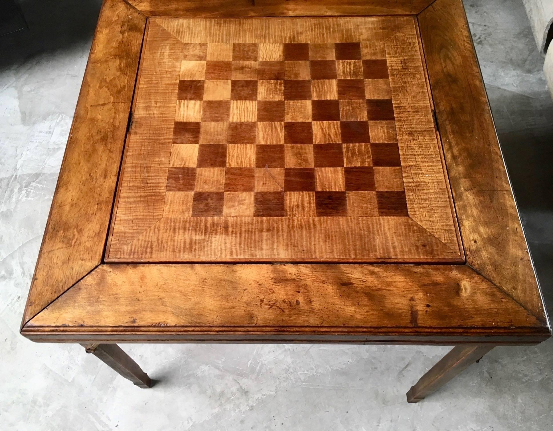 Great vintage game table with flip-top board. Super interesting flip mechanism. Cork backgammon board on one side, and wood chess board on the flip side. Great for cards, backgammon, chess. Legs fold in with metal hinges for storage. Great vintage