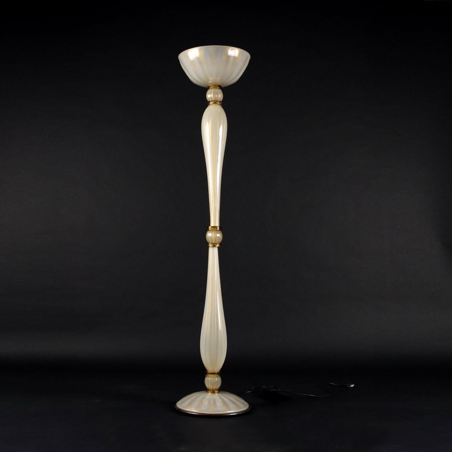 Floor lamp in the style of glass and brass. In good condition.