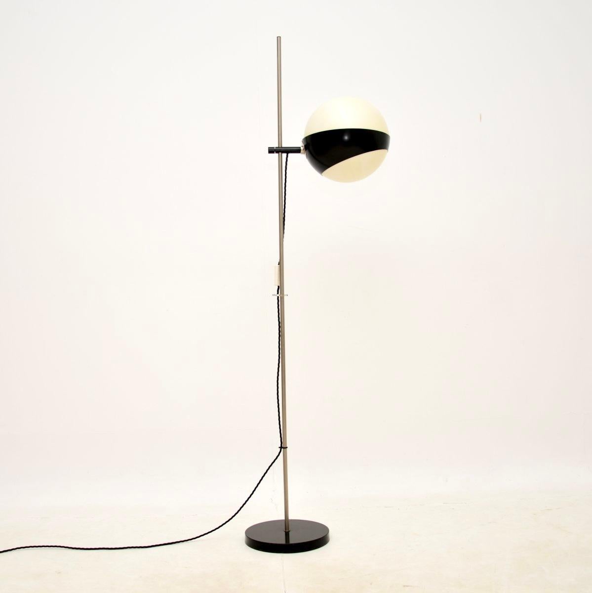 A stylish and extremely well made vintage floor lamp by Hala Zeist. This was made in the Netherlands, it dates from the 1960’s.

The quality is superb, this has a fantastic design with a white spherical acrylic shade that sits cradled in a black