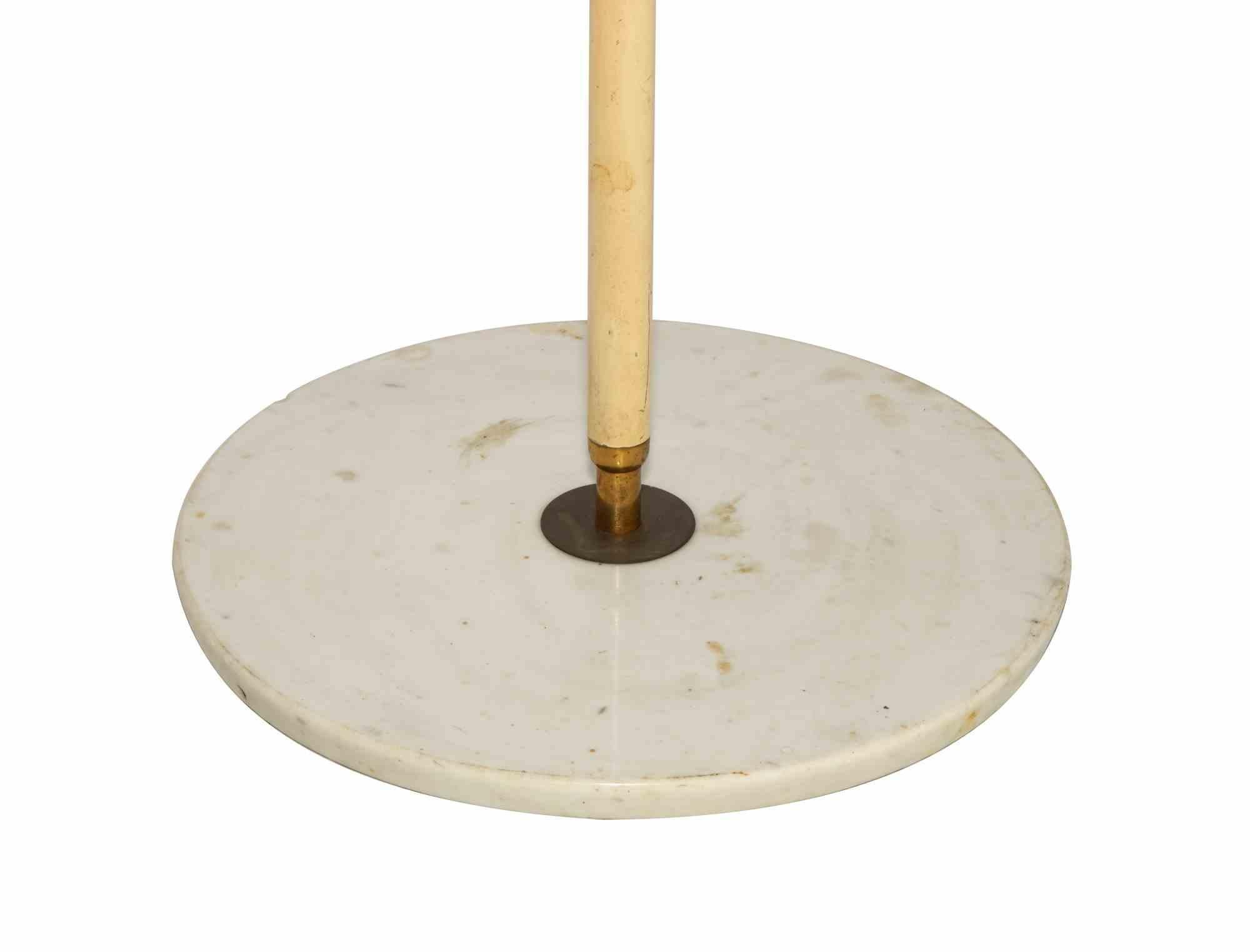Rare early 1950s adjustable Italian floor lamp marked Stilnovo, with red enameled shade and handle. Articulated brass arm on enameled metal pole and round Carrara marble base.