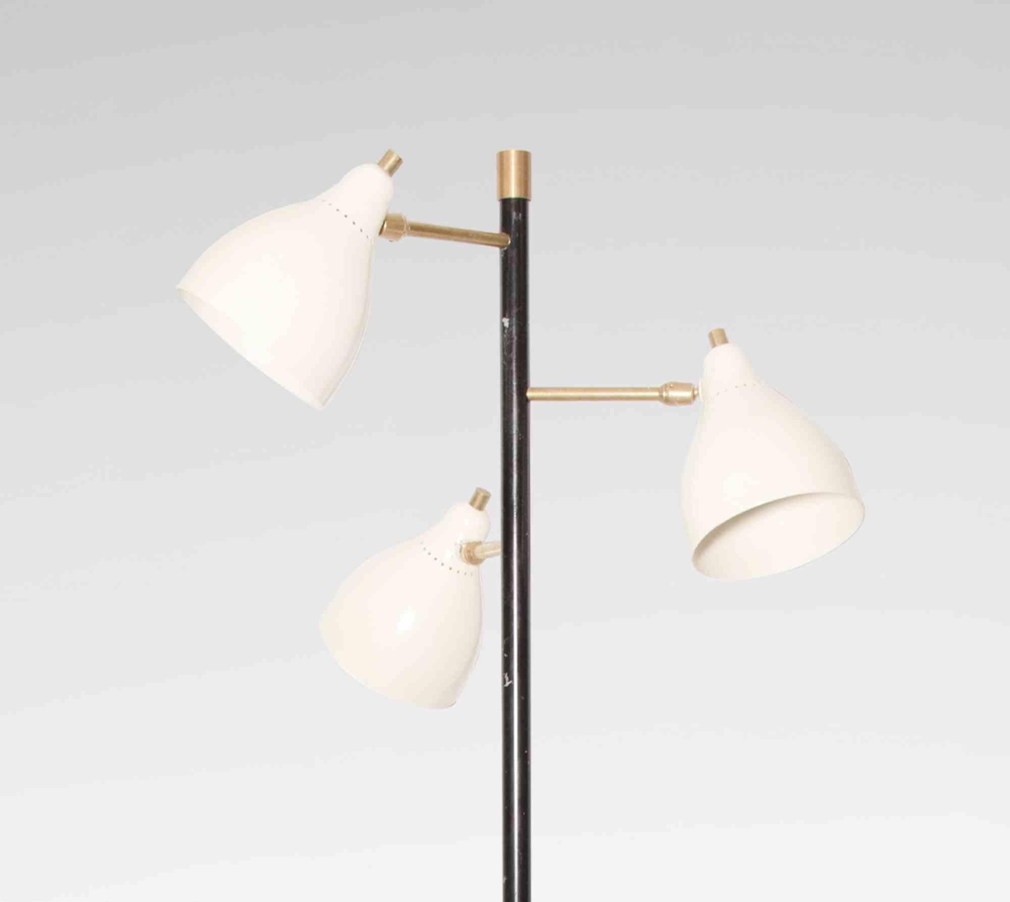 Vintage floor lamp is an original design lamp realized in the Mid 20th century.

 A beautifil three lights metal and brass lamp with a base in black marble.

Good condition. 

A perfect lamp to give a touch of vintage to your home!