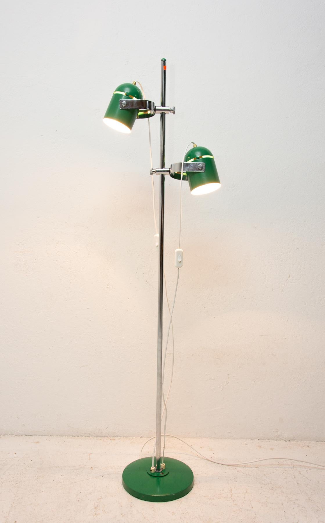 Elegant floor lamp or spotlight from the 1970s, it was designed by Stanislav Indra-famous Czechoslovak designer. Great fitting, that allows the lamp heads to adjust up and down along the post. Turned aluminum tapered bell-shaped shade. The center