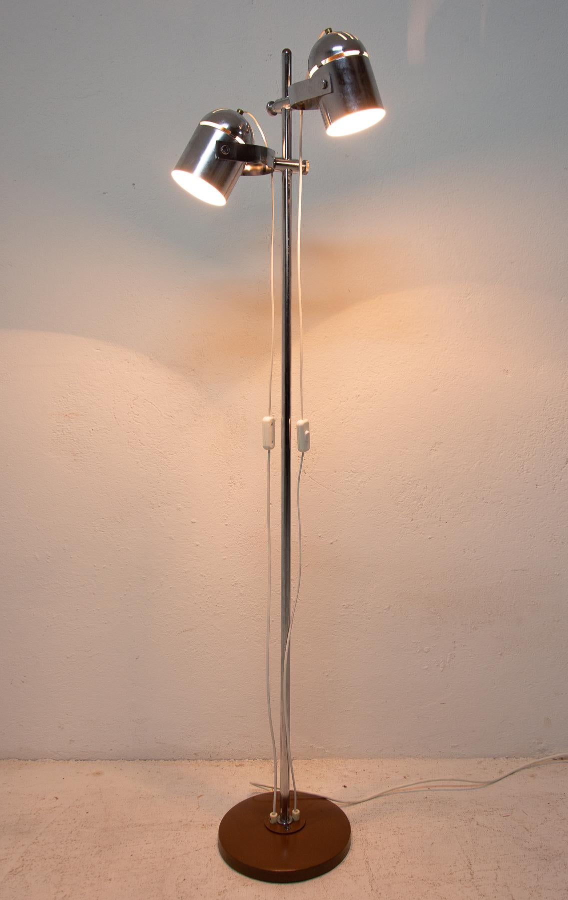 Elegant silver floor lamp or spotlight from the 1970s, it was designed by Stanislav Indra-famous Czechoslovak designer. Great fitting, that allows the lamp heads to adjust up and down along the post. Turned aluminum tapered bell-shaped shade. The