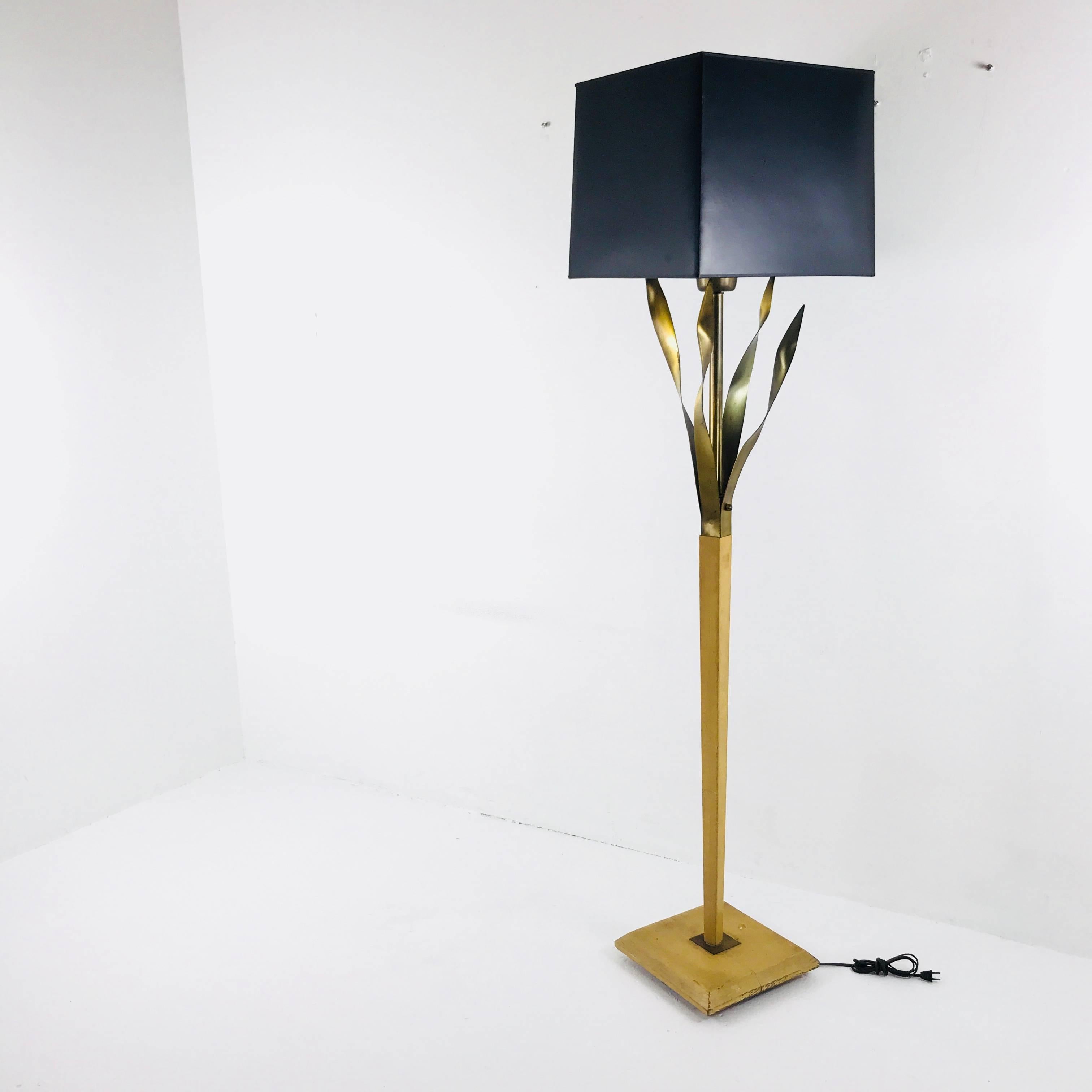 Brass and wood floor lamp shown with square shade, which is not included. The wood on the lamp needs to be refinished due to wear and tear and also retains original wiring. A shade will be required due to the bulb being exposed. There is no area to