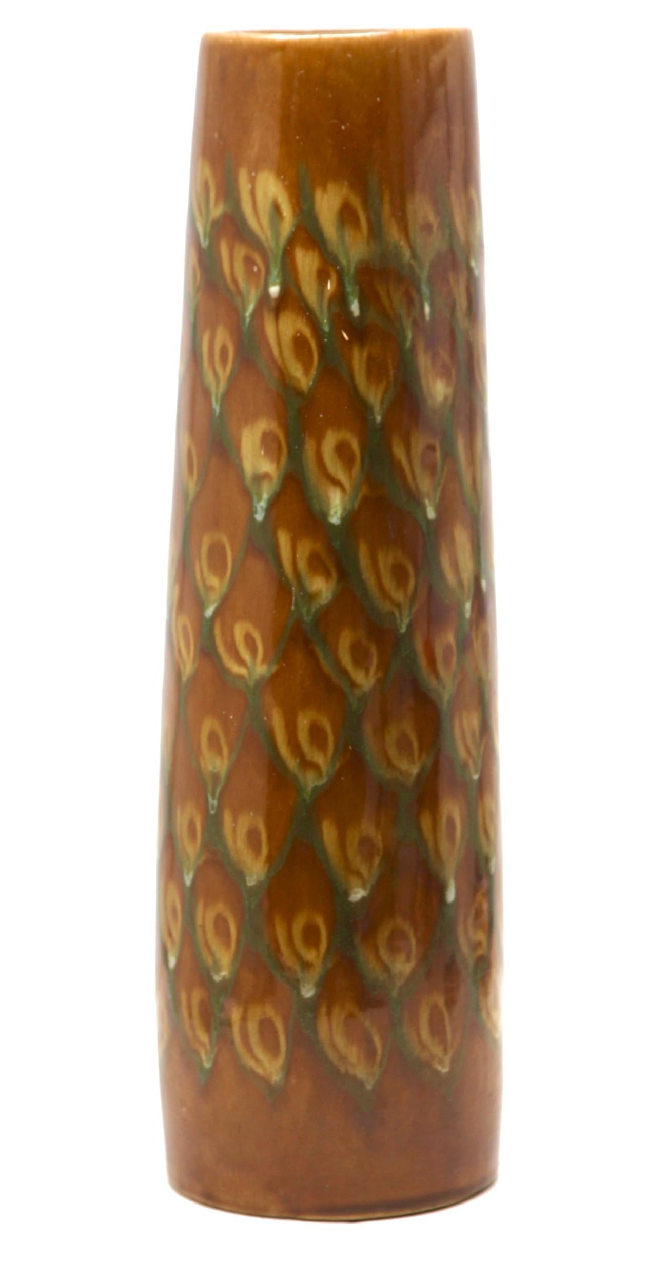 These original Floor vintage vase was produced in the 1960s in Germany. It is made of ceramic pottery. whit Slip Glaze Representation of peacock feathers
The bottom are marked the vase Handarbeit.
Straight forward and minimalistic design of the