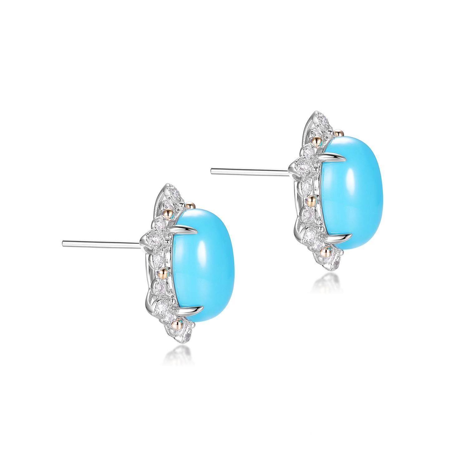 Questi splendidi orecchini mettono in risalto due vividi cabochon ovali di turchese, ciascuno di 10x12 mm, ammirati per la loro superficie liscia e il vibrante colore azzurro. Ogni turchese è circondato da una delicata aureola di diamanti tondi