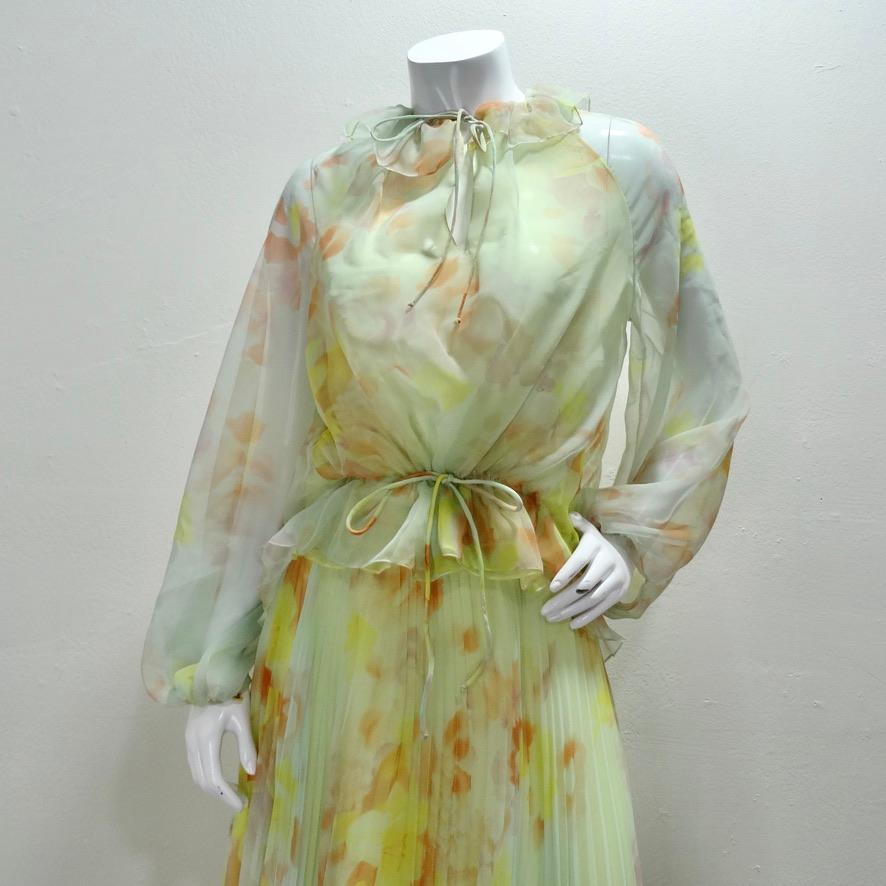 Breathtaking Malcolm Starr blouse and maxi skirt set circa 1960s! Stunning matching formal set in the most whimsical pastel floral print chiffon. The skirt starts fitted at the waist with a hook and zipper closure and cascades down into a pleated,