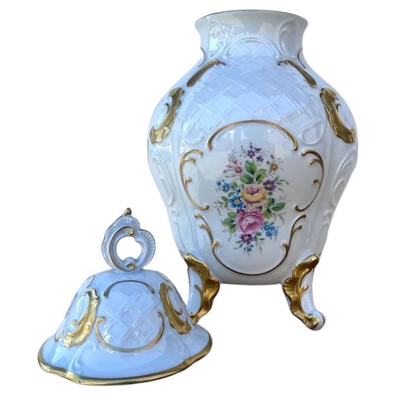 Lindner porcelain vase beautifully decorated with gilding and bouquets.

Germany.

Vintage.

Beautiful embossed surface.

Perfect condition.

Brand and number in the test.

Size:

Height - 14 in (36 cm)
Diameter - 9 in (23 cm).