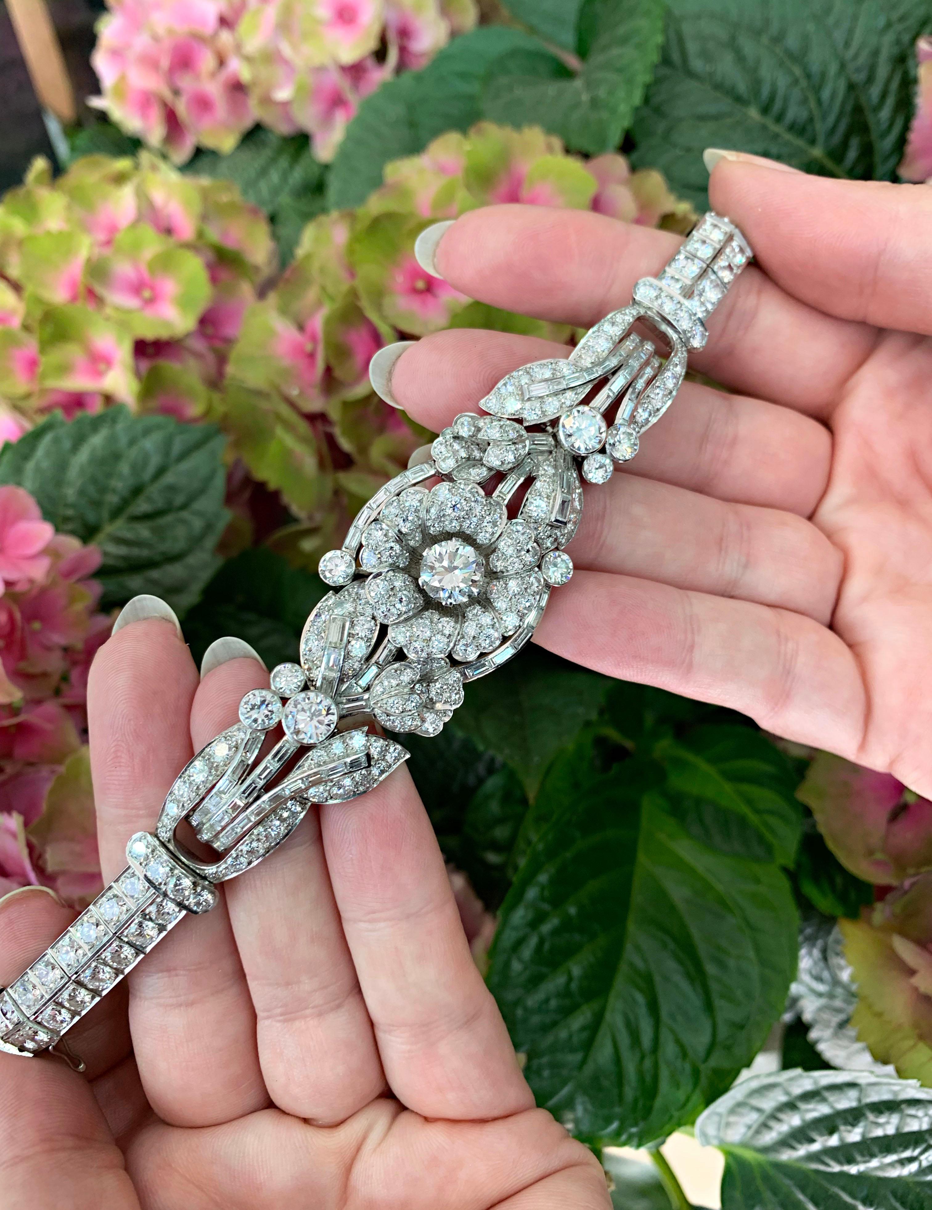 Exceptional all diamond art deco inspired bracelet set with brilliant cut diamonds and baguette cut diamonds with an approximate total weight of 20.00 carats. This exquisite sectional bracelet has an openwork floral design, set with a fine quality
