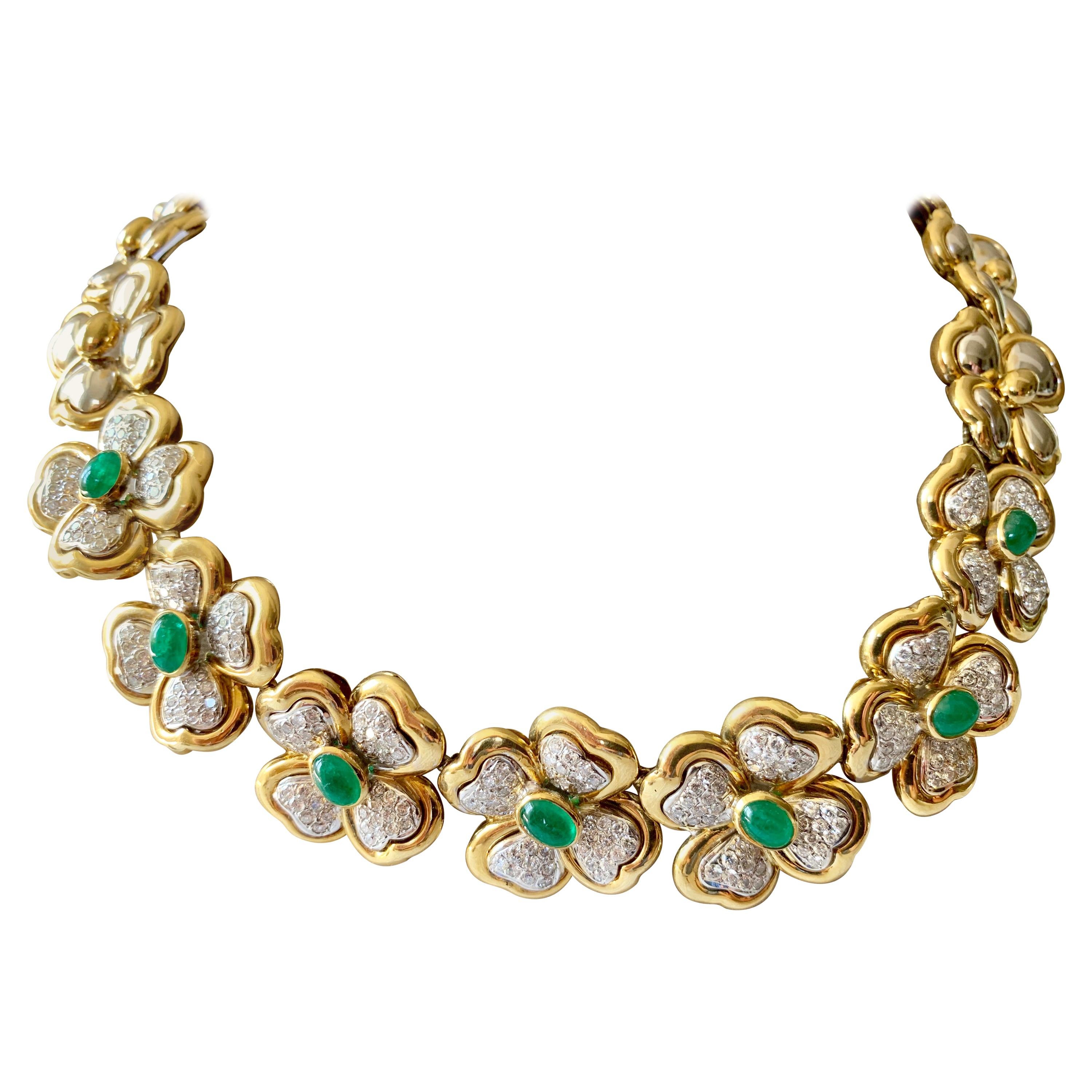 Elegant 18 K white and yellow gold necklace of floral design. Set with 7 Emerald cabochons weighing approximately 3.50 ct and 252 brillinat cut diamonds of circa 5 ct, H color and vs clarity. This stunning necklace lies beautifully on every lady's