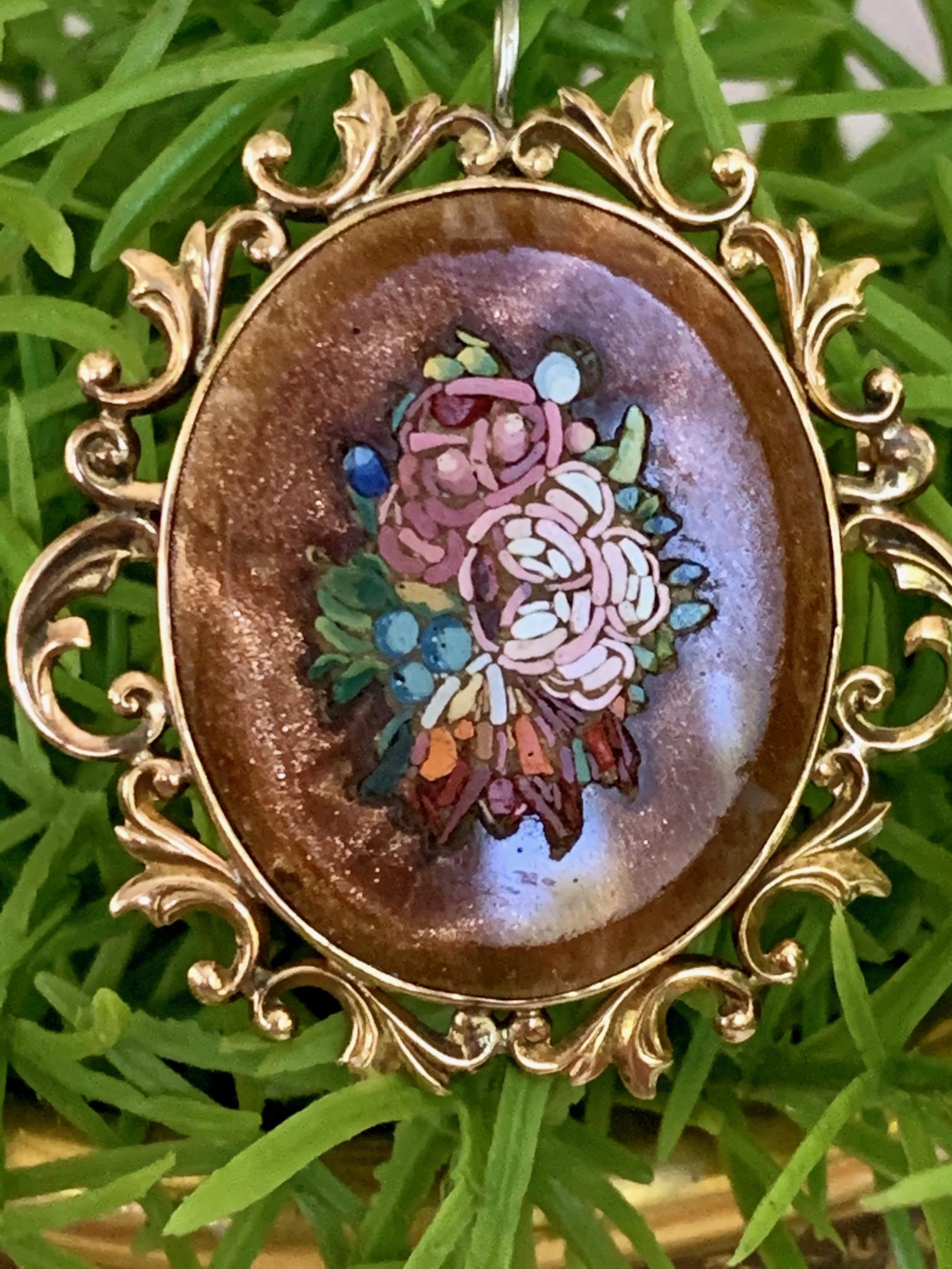 This vintage floral Micromosaic Pine/Pendant in Gold stone is set in 10k yellow Gold.  
There is no stamp.
Size = approximately 42 x 41mm
Weight: 12.7 grams

This is in very good condition. 