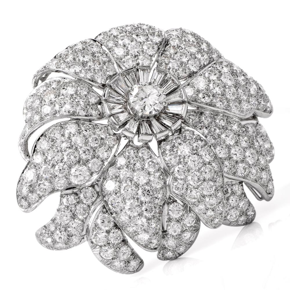 This meticulously crafted and versatile lapel brooch and pendant simulates an enchanting flower head with multiple petals rendered in solid platinum. With remarkable glitter, this exquisite monochromatic piece of jewelry is centered with a 0.70