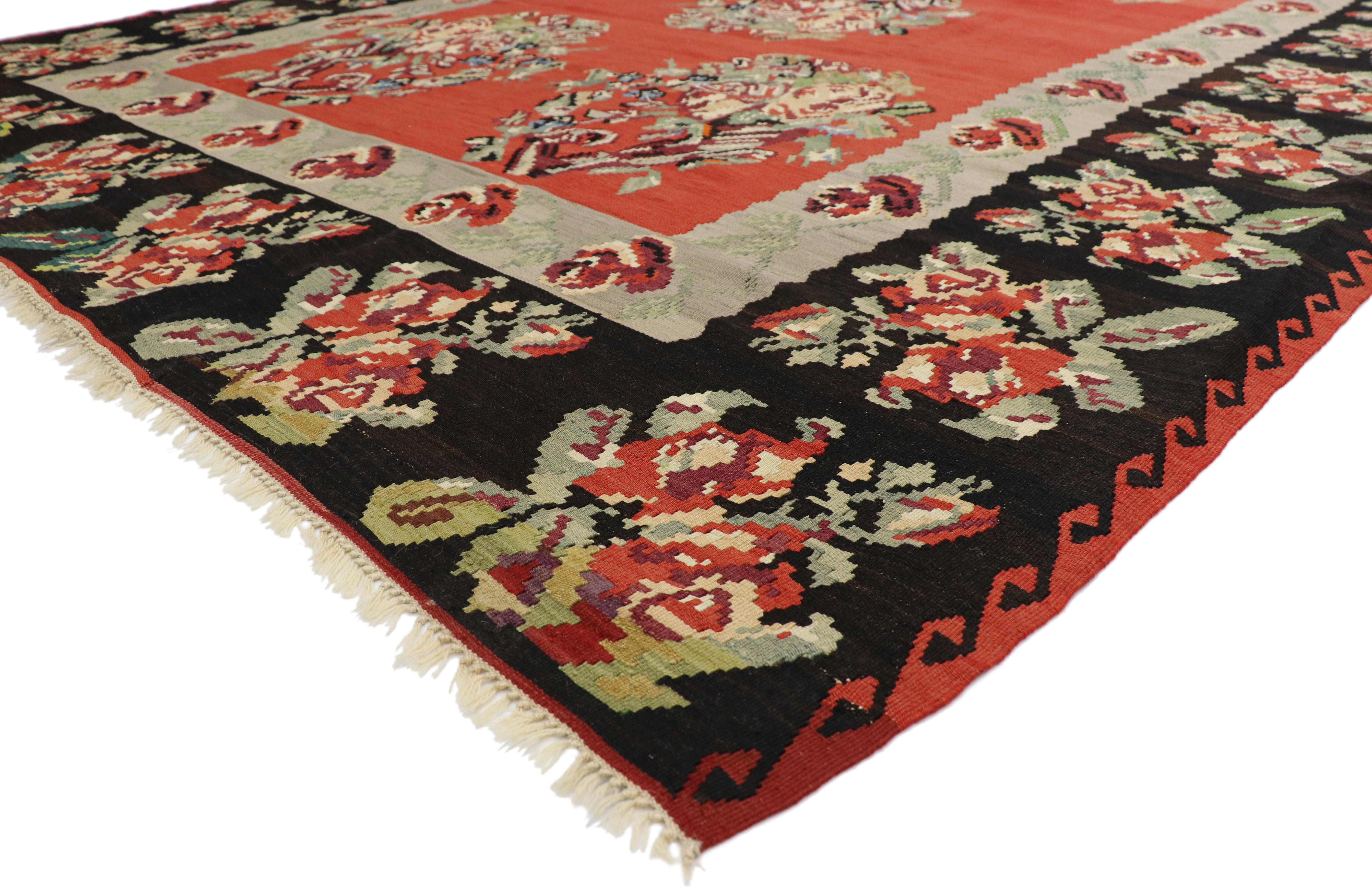 74245, vintage Floral Turkish Kilim rug. Give a lively and light hearted feel with a rose kilim rug. This handwoven wool vintage floral Turkish kilim rug features five stylized rose bouquets in an abrashed red field. A contrasting black border with