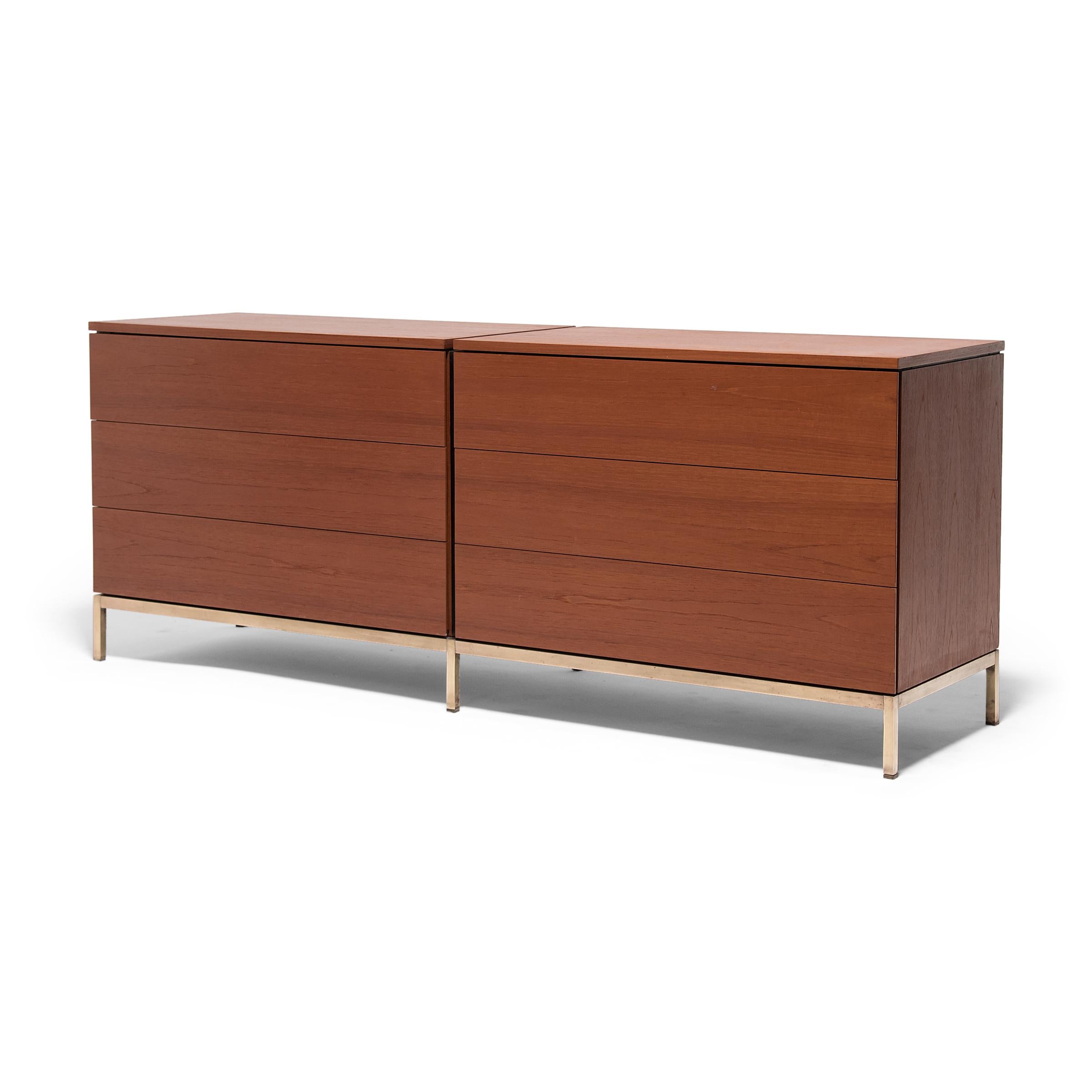 Elevated by a brass metal base, this double chest of drawers by iconic designer Florence Knoll for Knoll International epitomizes midcentury furniture design. Guided by functionality, the credenza's seamless form is fitted with six wide drawers and