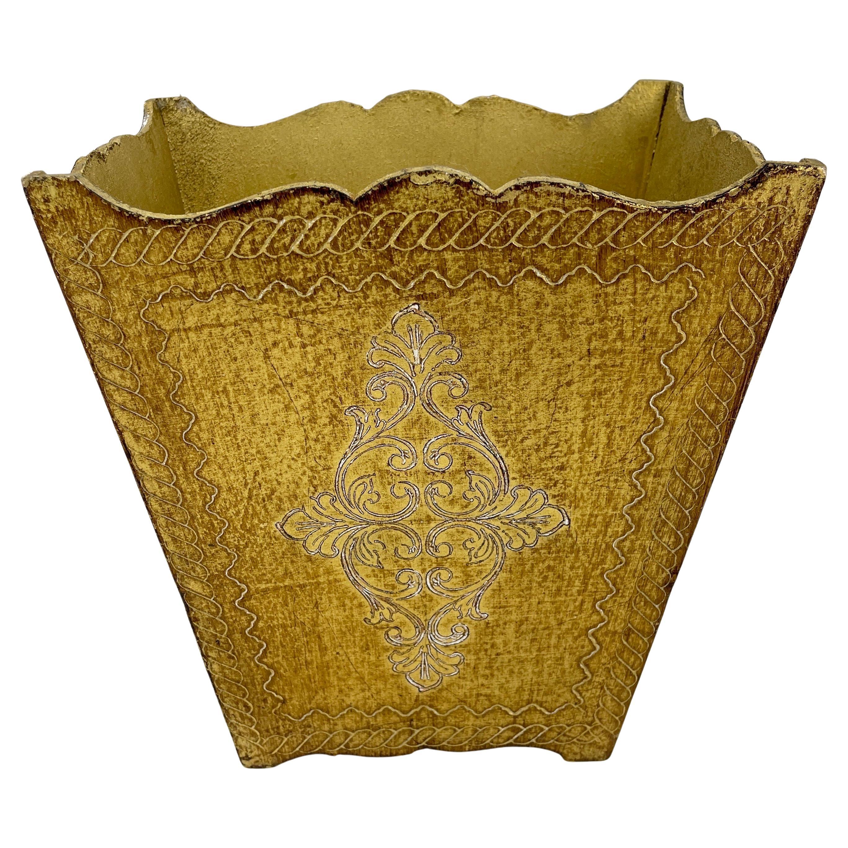Signed Italian Florentine trash can or waste basket.

Nicely gilt decorated Italian neoclassical Florentine waste basket with hand decorated gold engraved patterned design. Perfect addition to you bedroom, vanity space, office powder bath room.