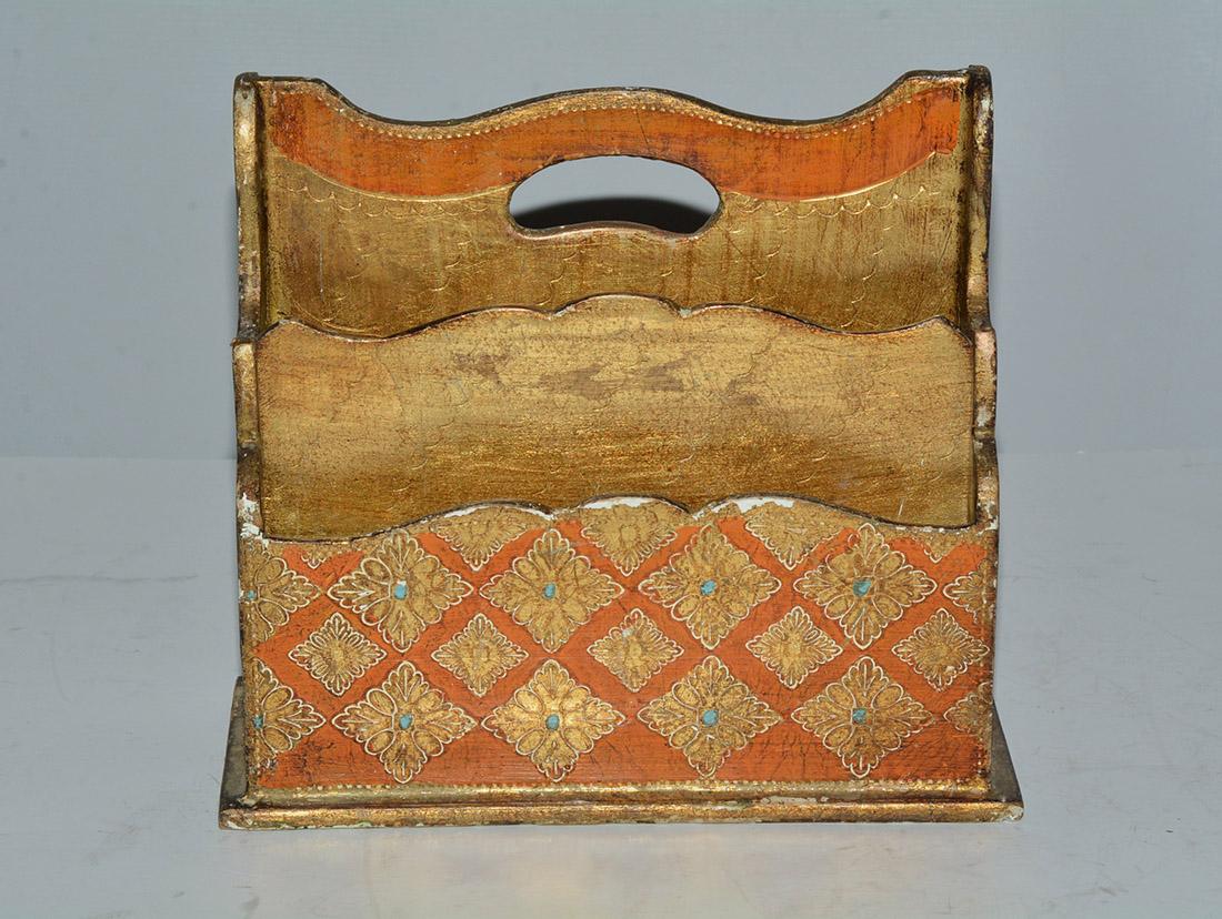 Elegant diamond shapes in gilt decorates this Italian Florentine desk organizer in orange and gold. Dainty engravings are formed in the diamonds. The inside is also finished in a gold gilt and orange. Beautiful panels with two divided compartments