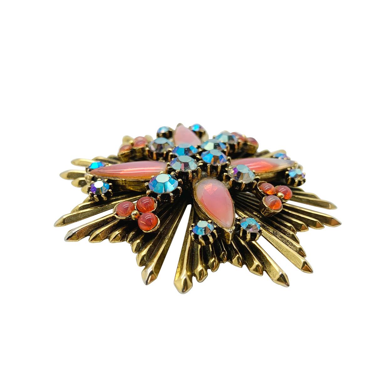A wonderfully dramatic and opulent vintage Florenza opaline brooch. The forever stylish Maltese cross inspired design is lavishly decorated with an array of stones. The large and impressive opaline teardrop stones give way to smaller cabochon
