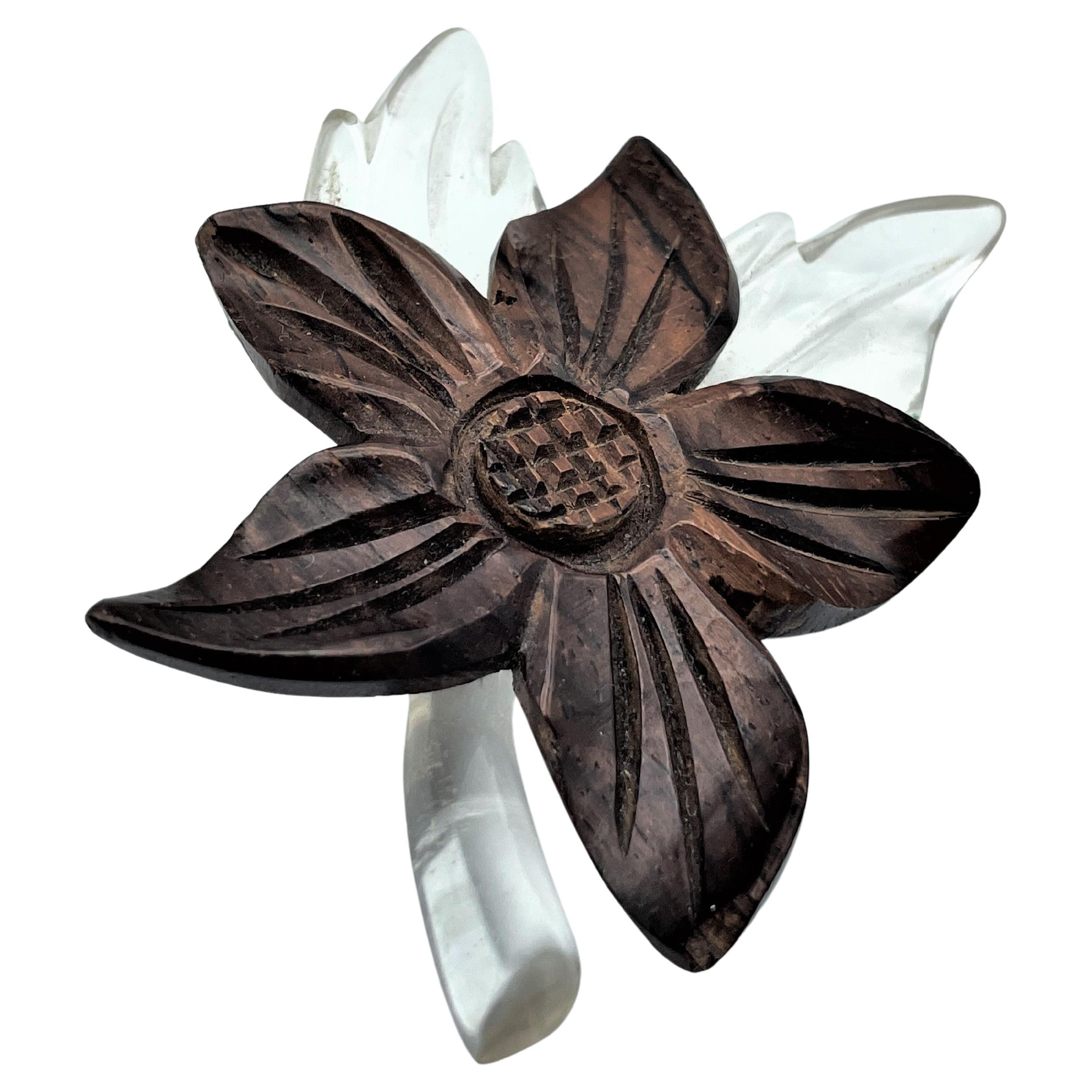 Loving flower brooch made in the 1930s USA. Window glass from the aircraft industry was used for this type of jewelry! . 
The flower was cut out of wood and placed on the Lucite leave and stem. 
Measurement : W 6 cm x H 7,5 cm, Deep with flower  1,4