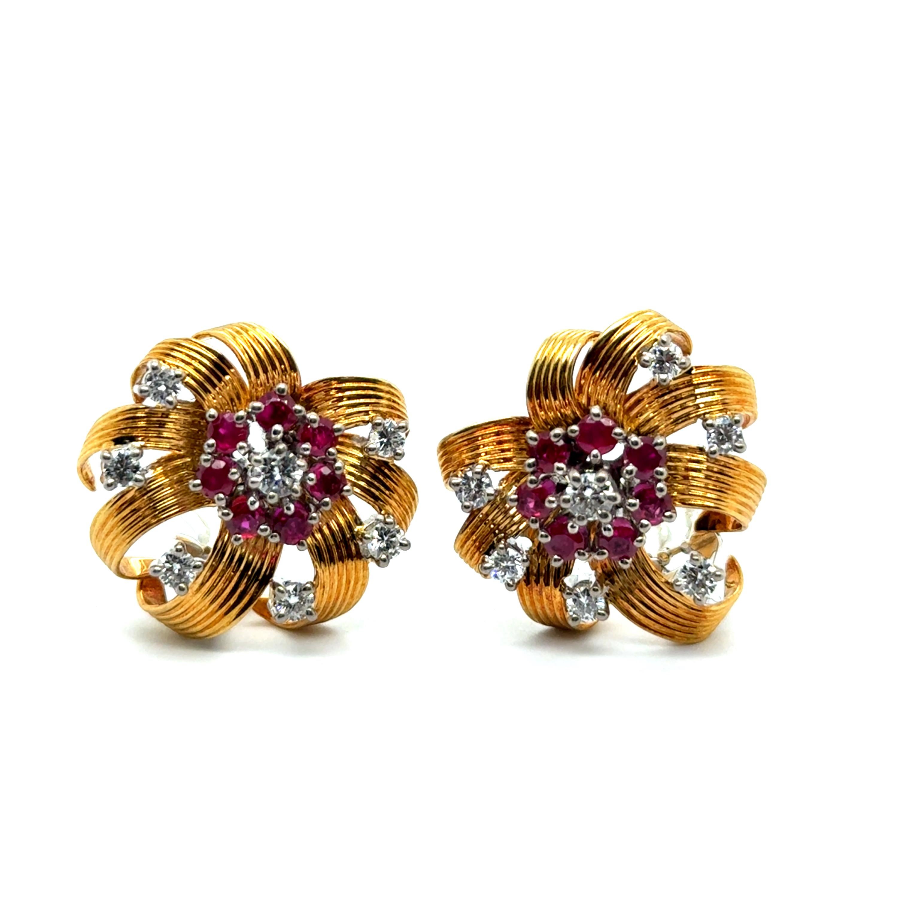 Delicate and whimsical, these Clip-on Earrings evoke the vibrant spirit of a tropical flower. 

Crafted in exquisite 18K yellow and white gold, their design blooms with elegance. Fourteen untreated Burmese rubies and fourteen brilliant-cut diamonds