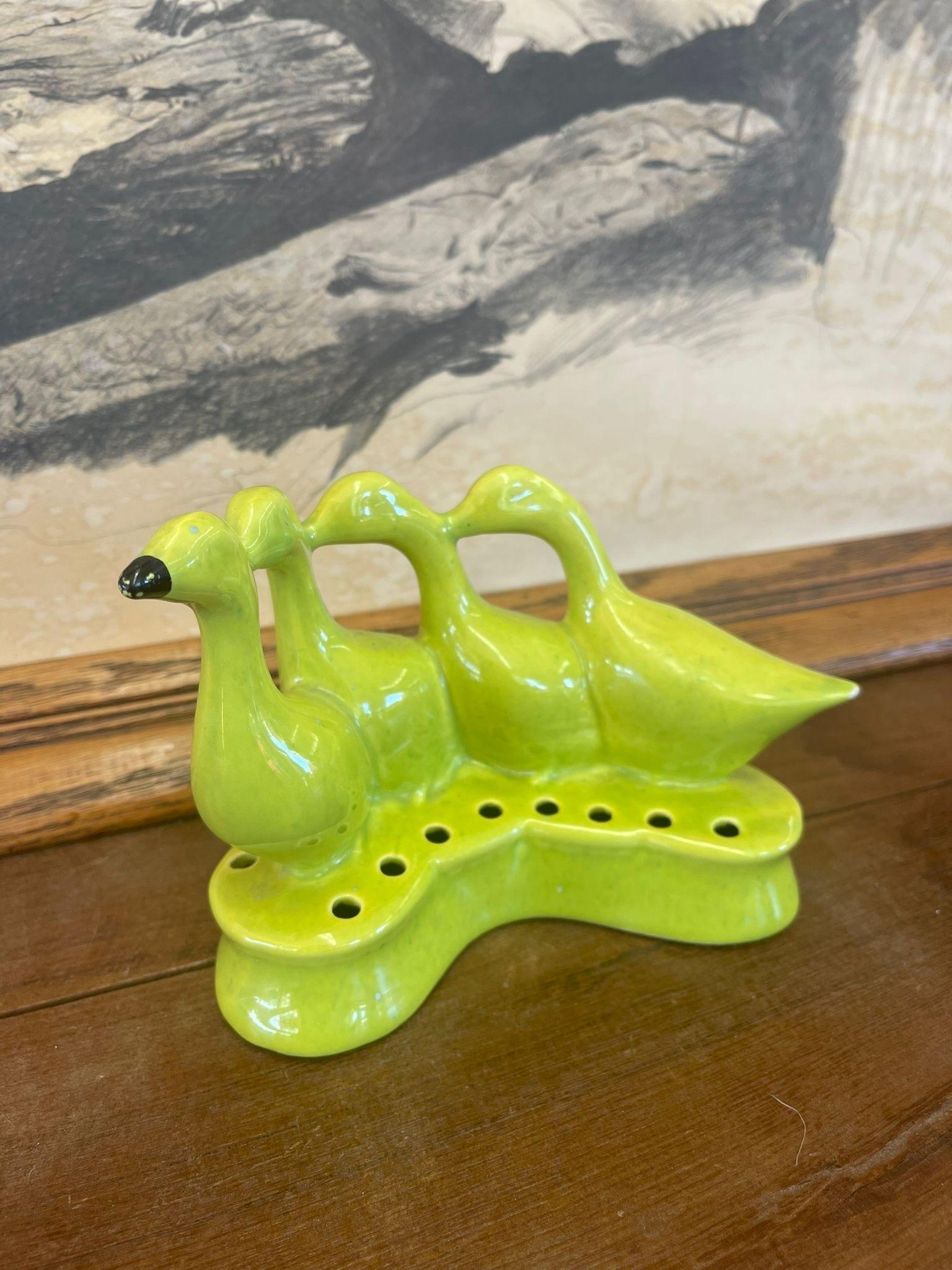 This Piece Features a Sculpture of  4 Ducks Walking ina Line. Bottom is Completely Sealed , Ready for Stems. Lime Green Color.

Dimensions. 7 W ; 4 D ; 5 H