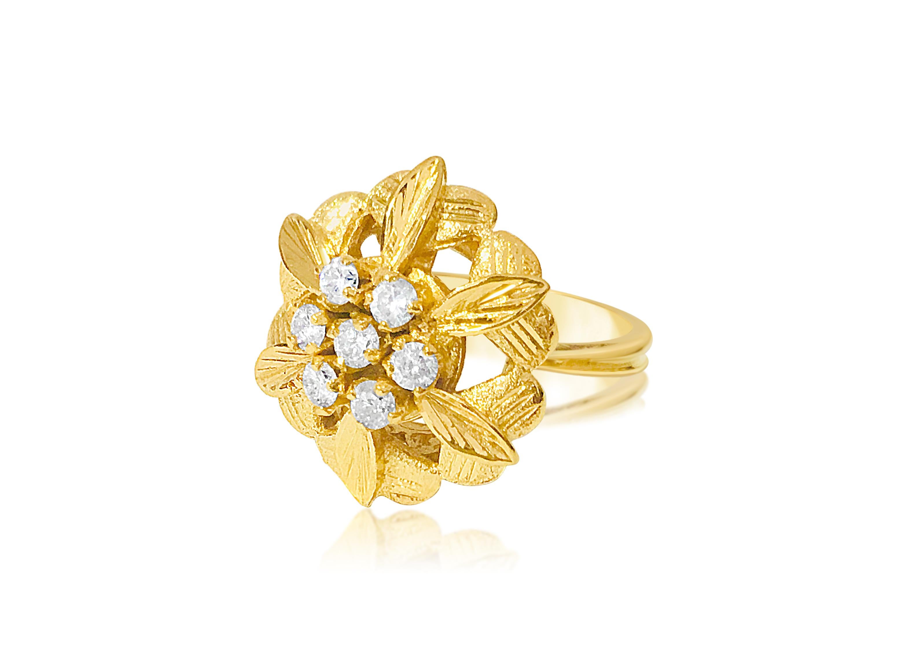 Metal: 18K yellow gold. 
0.38 carat diamonds total. SI clarity and F-G color. 100% natural earth mined diamonds. Round brilliant cut diamonds set in prongs.
Ring size: US 5. Free ring resizing available.
Gorgeous open flower inspired vintage ring.