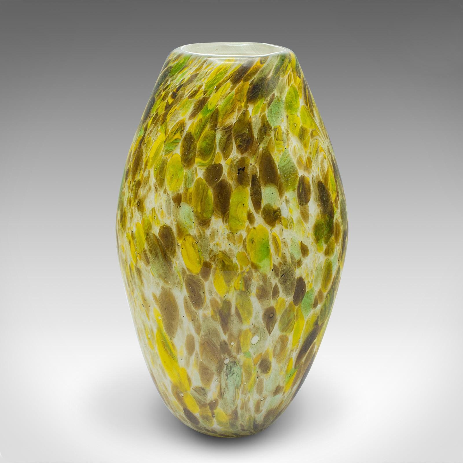 
This is a vintage flower vase. An English, art glass decorative ovoid pot, dating to the mid 20th century, circa 1960.

Fascinating colour palette and application
Displays a desirable aged patina and in good order
Blown glass in ovoid form, with