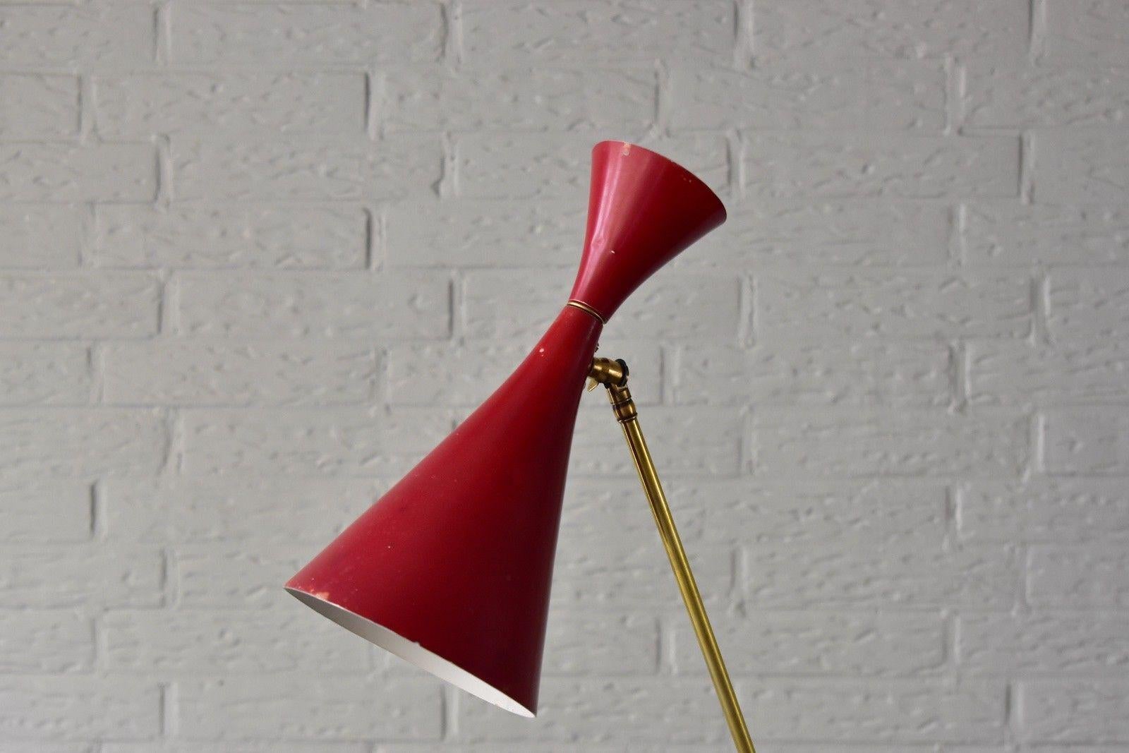 Nice vintage 1960s Fog & Mørup floor lamp. Original red colored shade with brass adjustable arm and heavy metal base. The brass items are polished, the black base is repaint. Shade in original color. Electric is redone with E26/27 Edison socket so