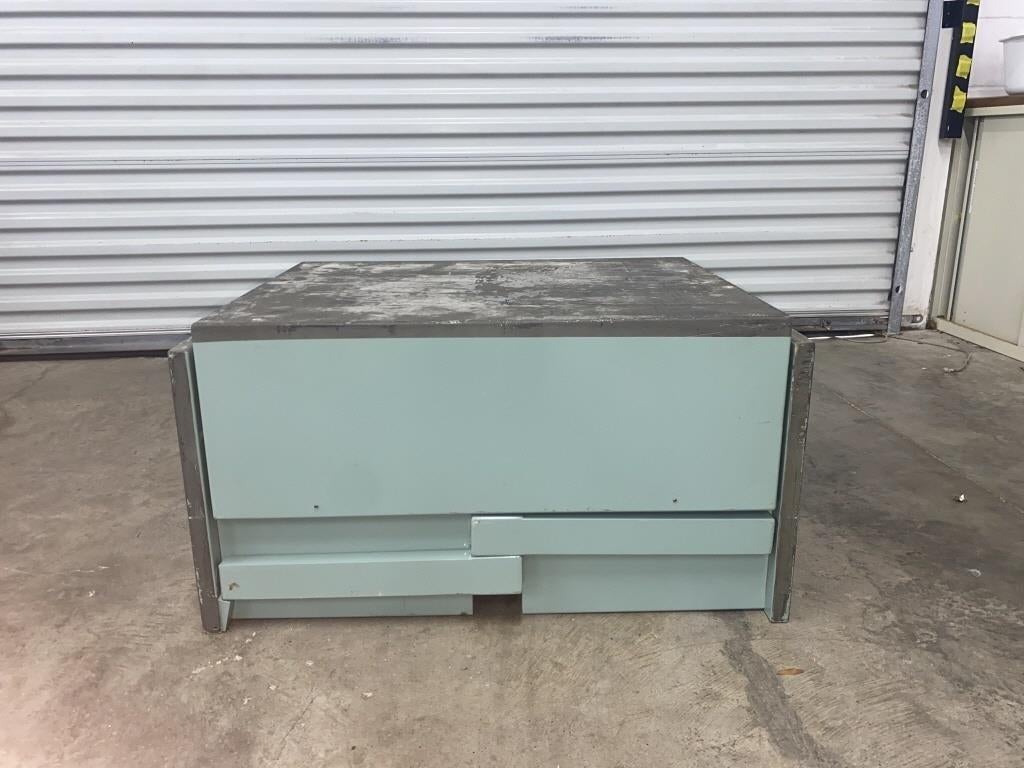 Vintage WWII Military Field Desk

 A vintage US Military aluminum celadon green painted metal folding field desk. Transforms from a rectangle to  portable desk. The top is hinged and the legs fold down. It has a deep drawer for files on the left and
