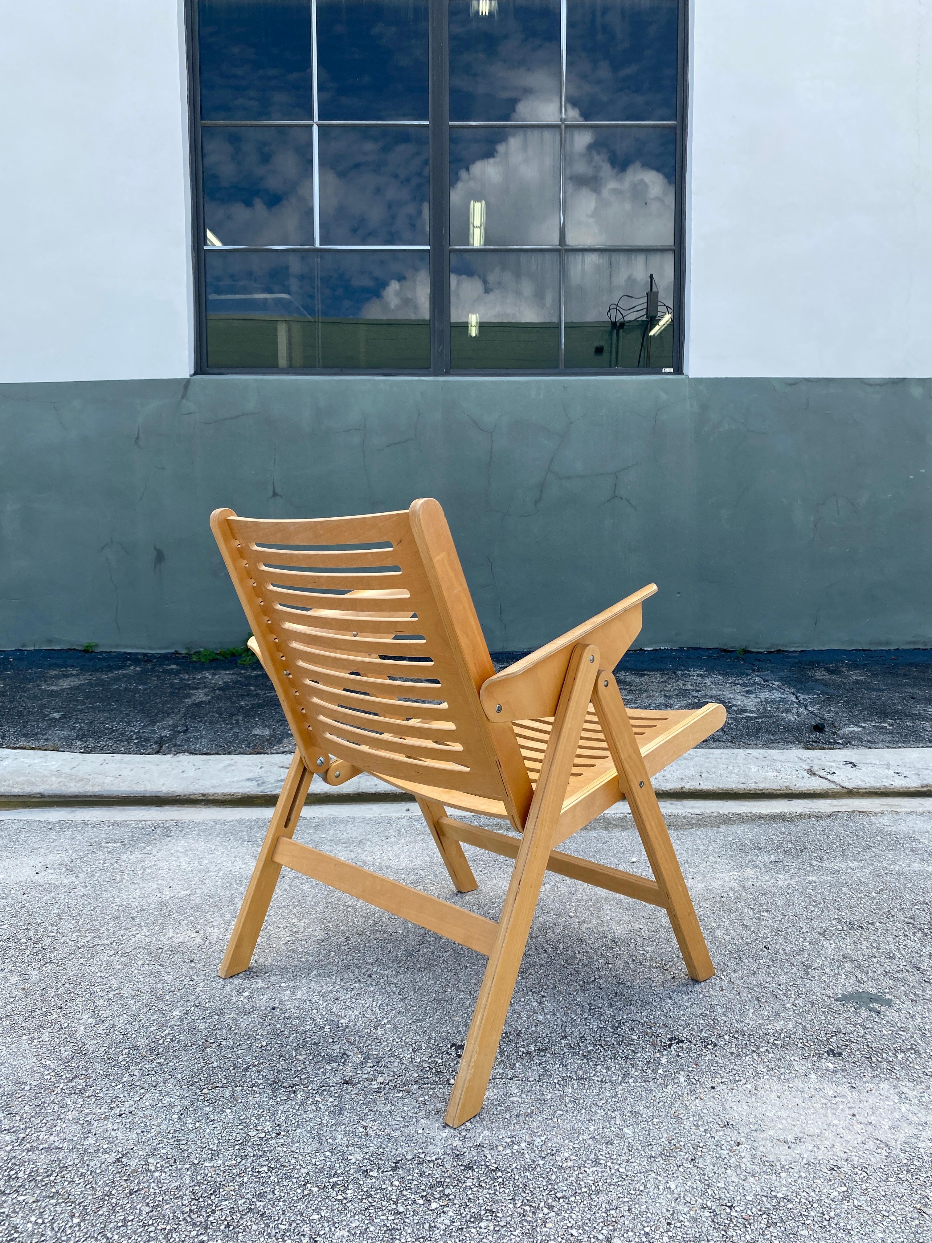 Vintage Beech Bentwood folding chair is in the permanent collection of the Museum of Modern Art in NY. Features molded plywood with contoured back and cutouts.

Measures: 33”H x 22”W x 28”D x 16”Seat H.

 